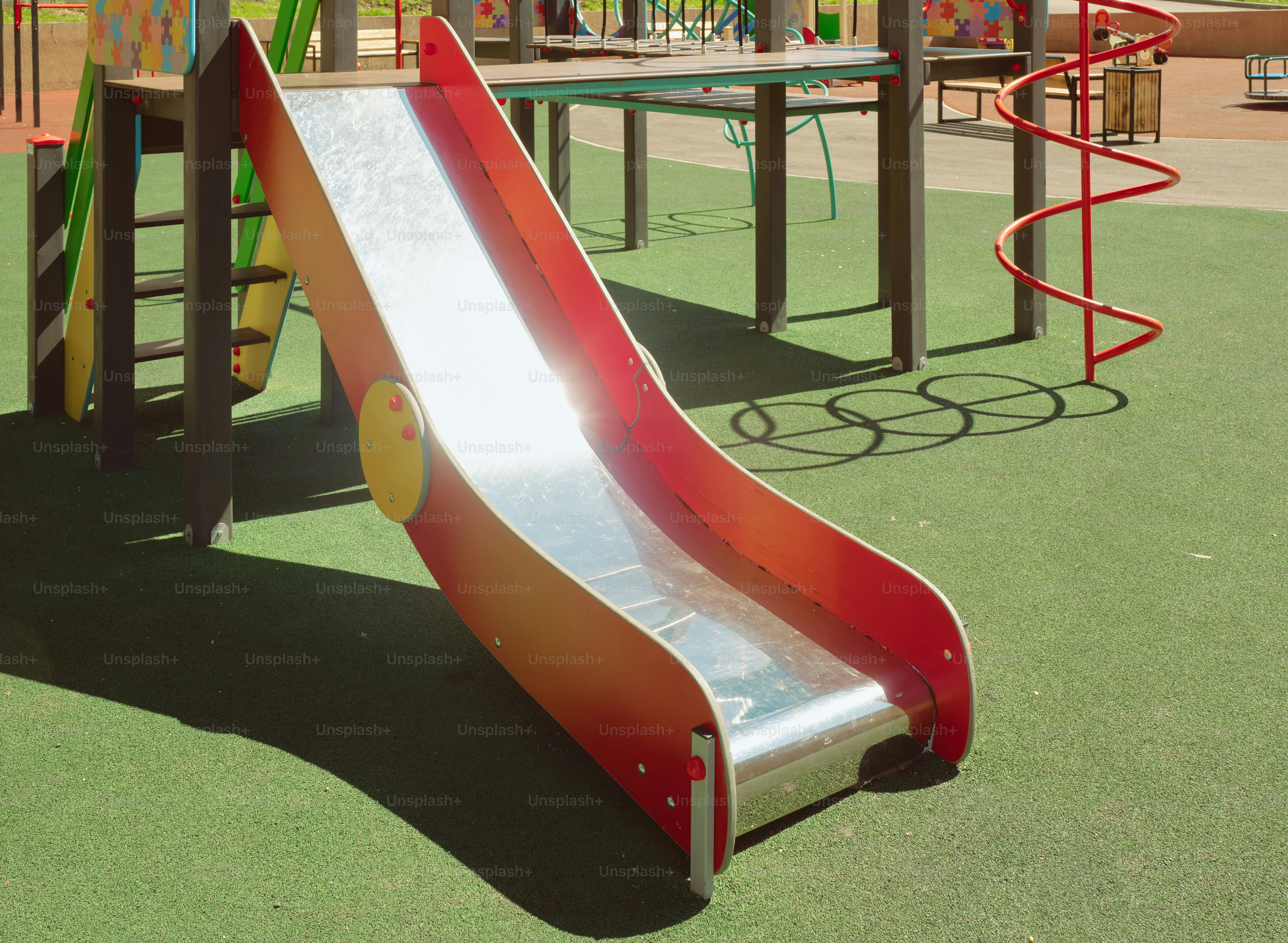 A colorful slide on a playground.