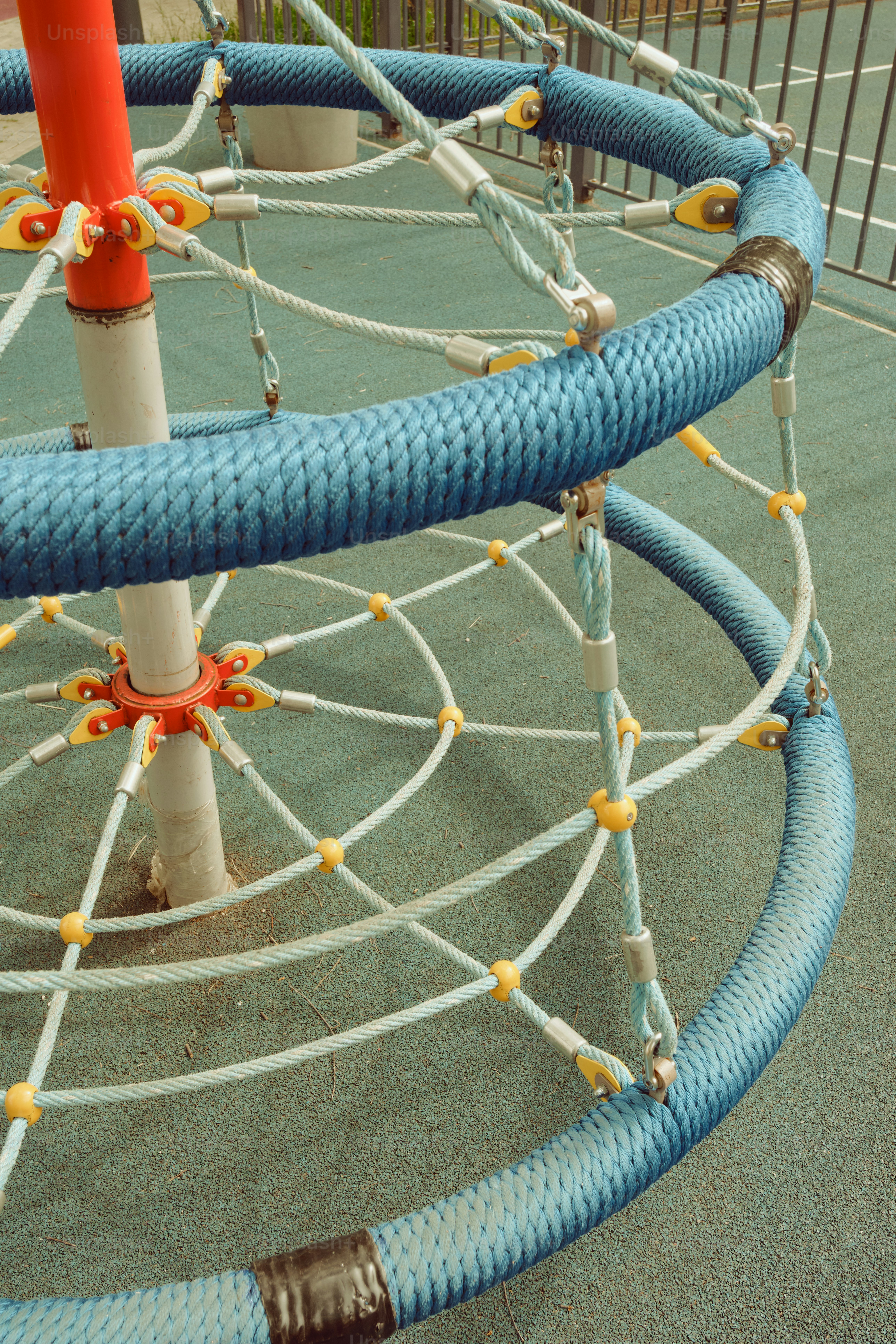 A climbing structure made with ropes and blue coils. photo – Aesthetic ...