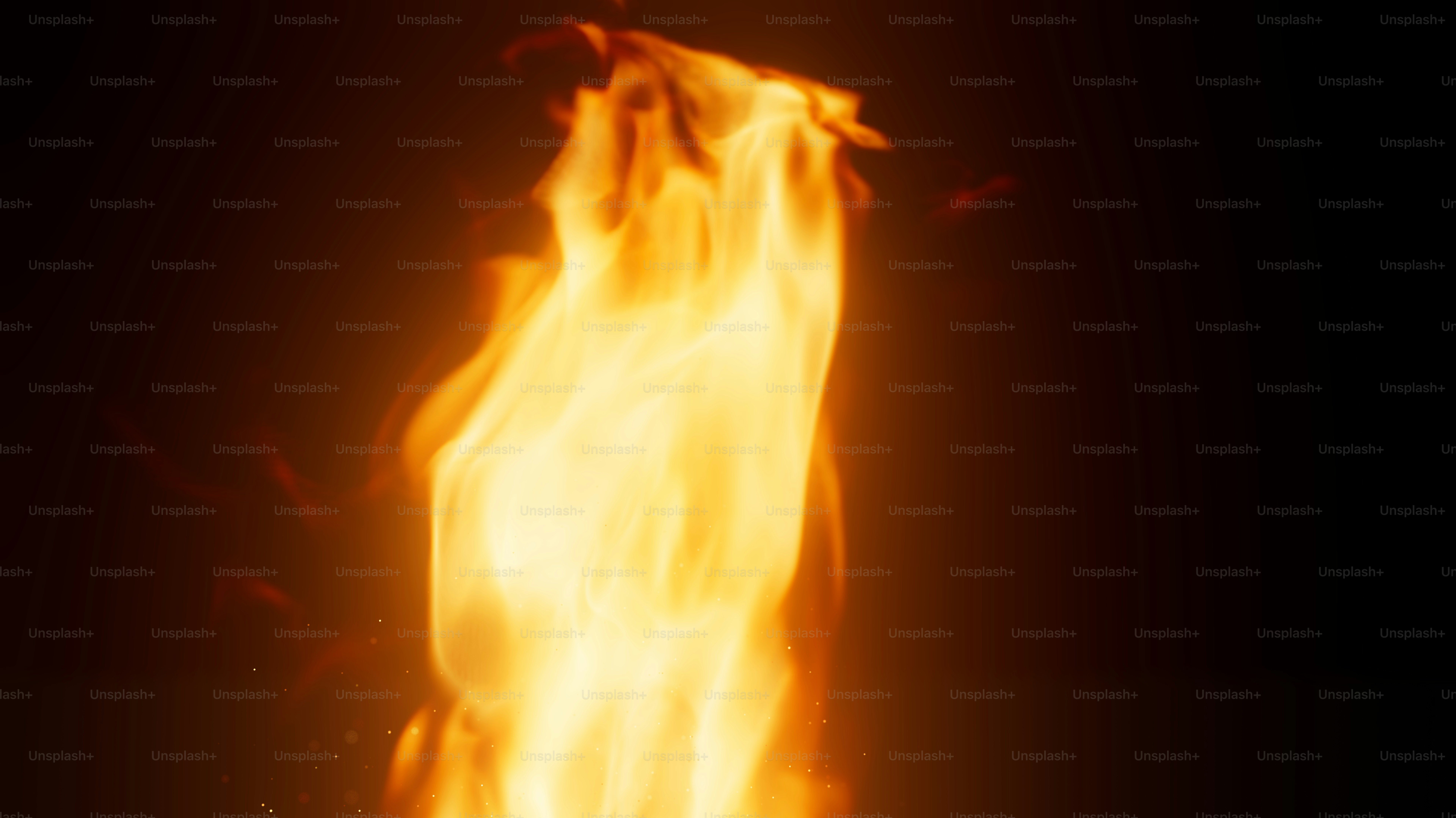 Here's a caption: flames dance against a dark background.