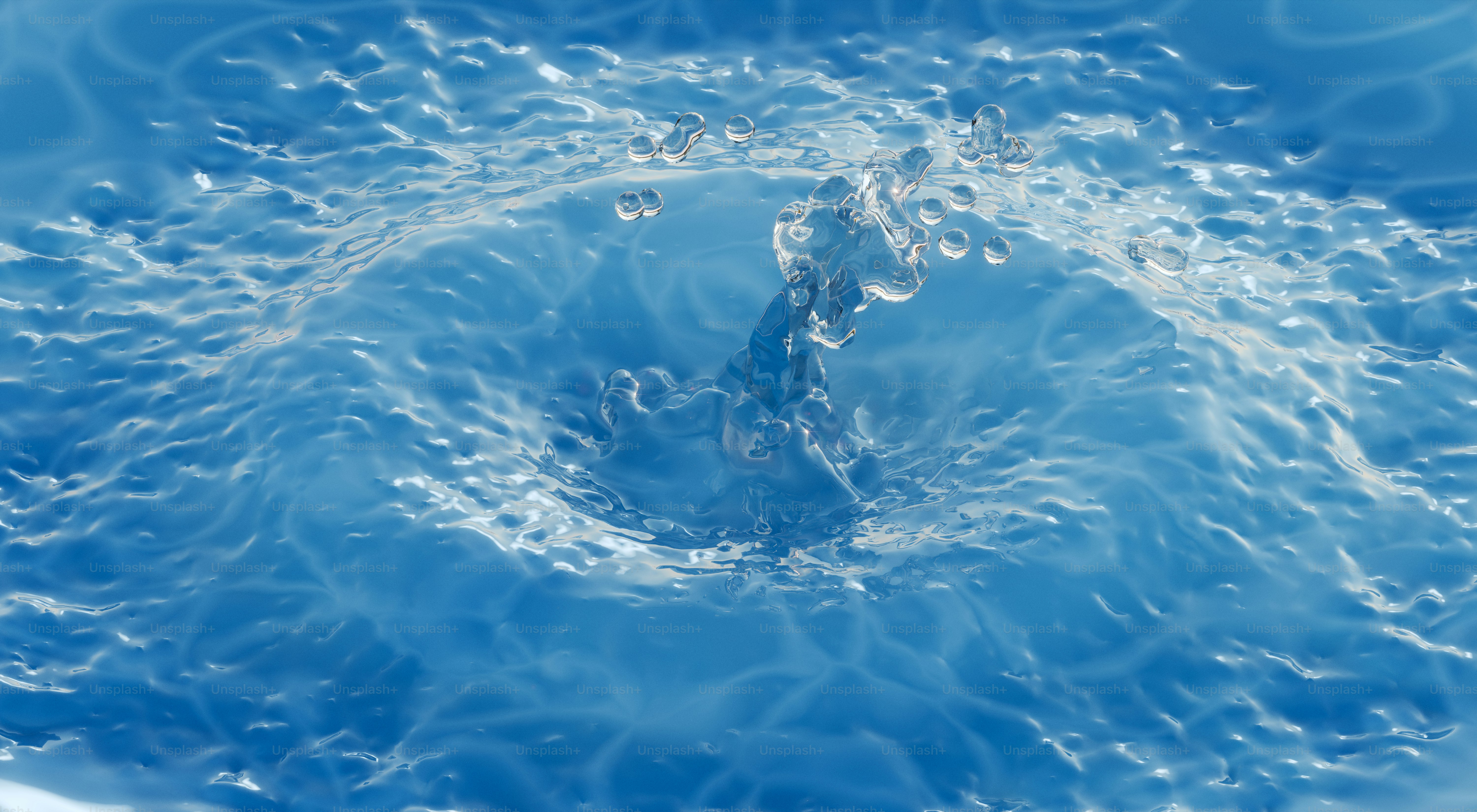 Water droplets creating a rippling effect.