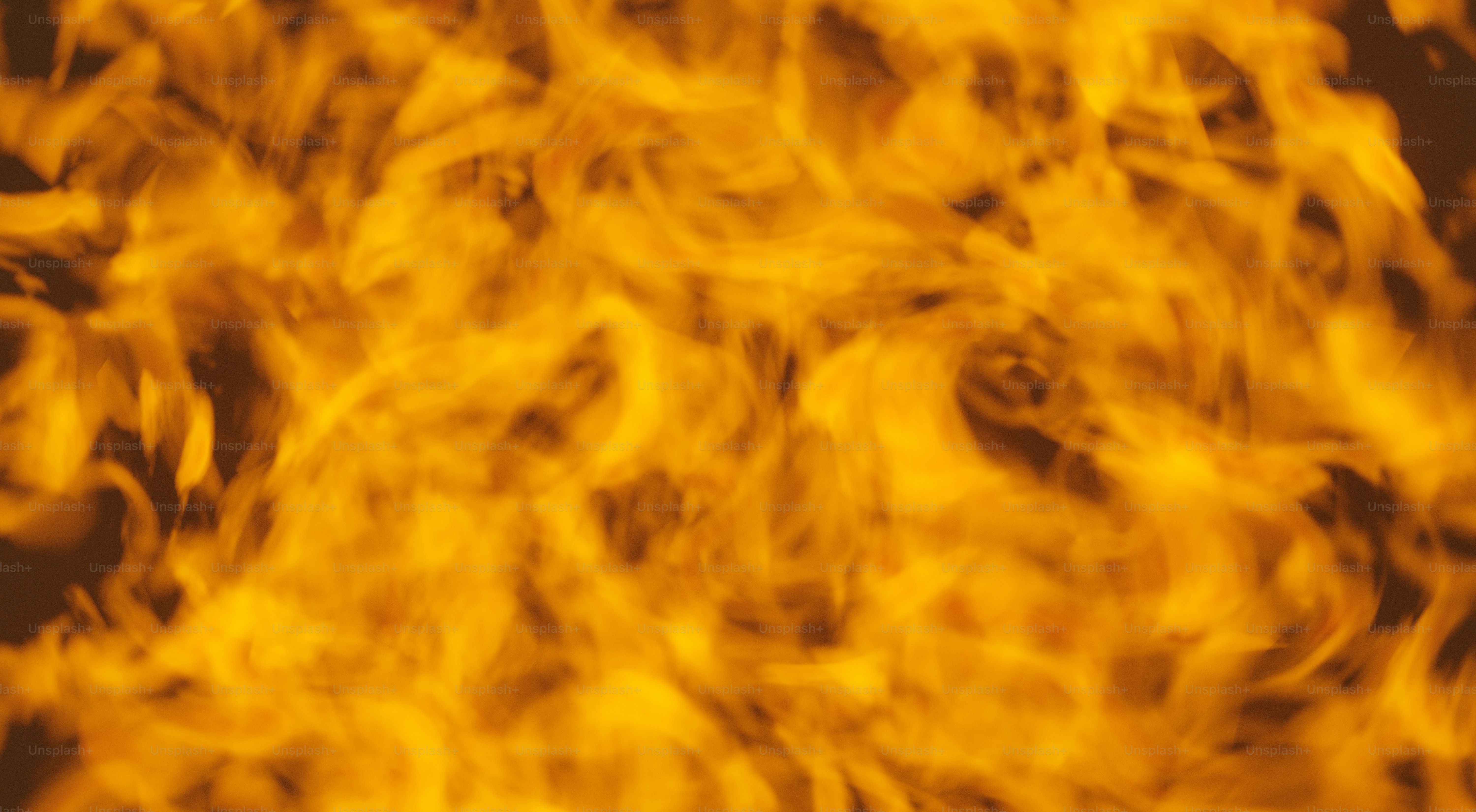 Flames burn brightly against a dark background.
