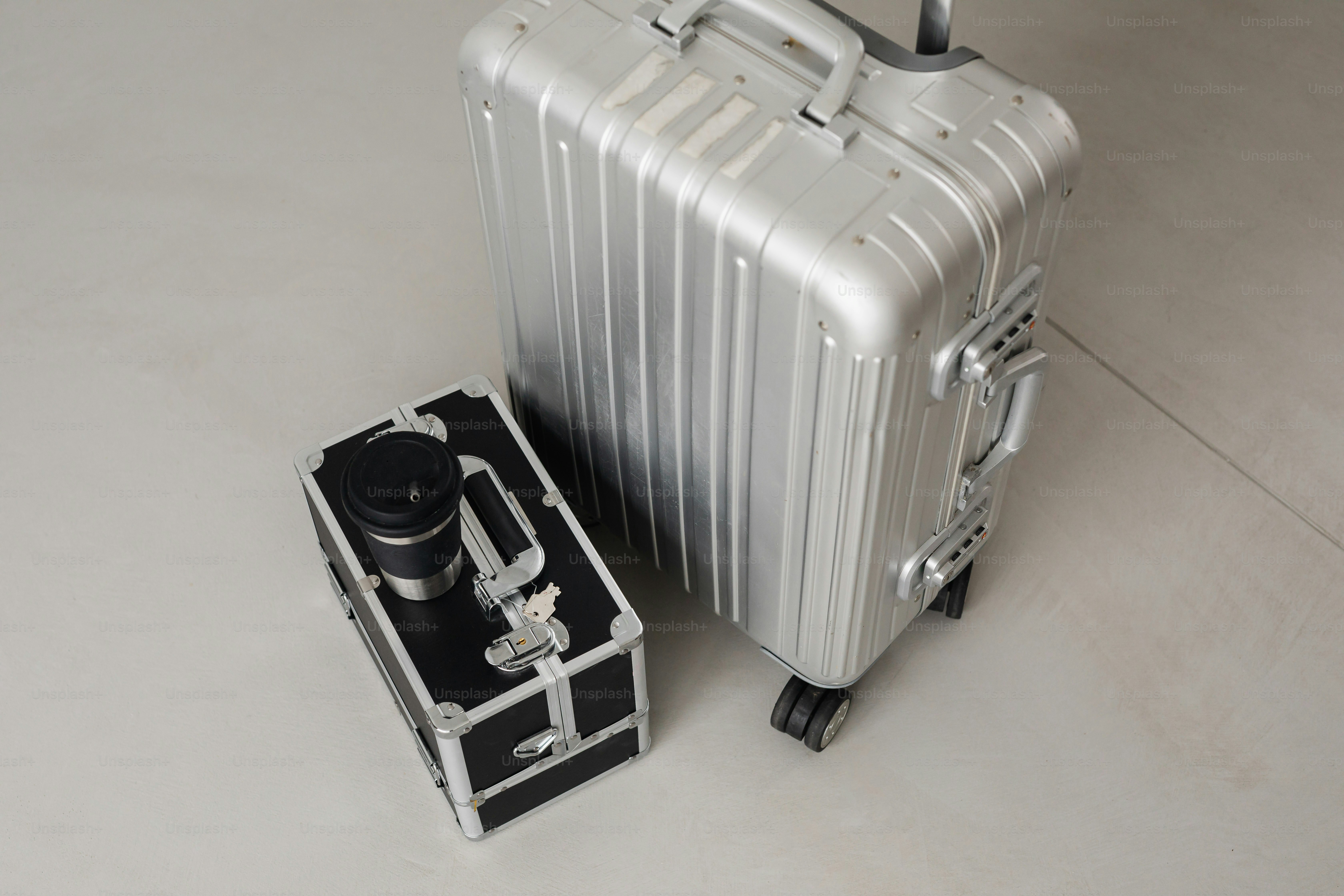 Silver suitcases are ready for travel.