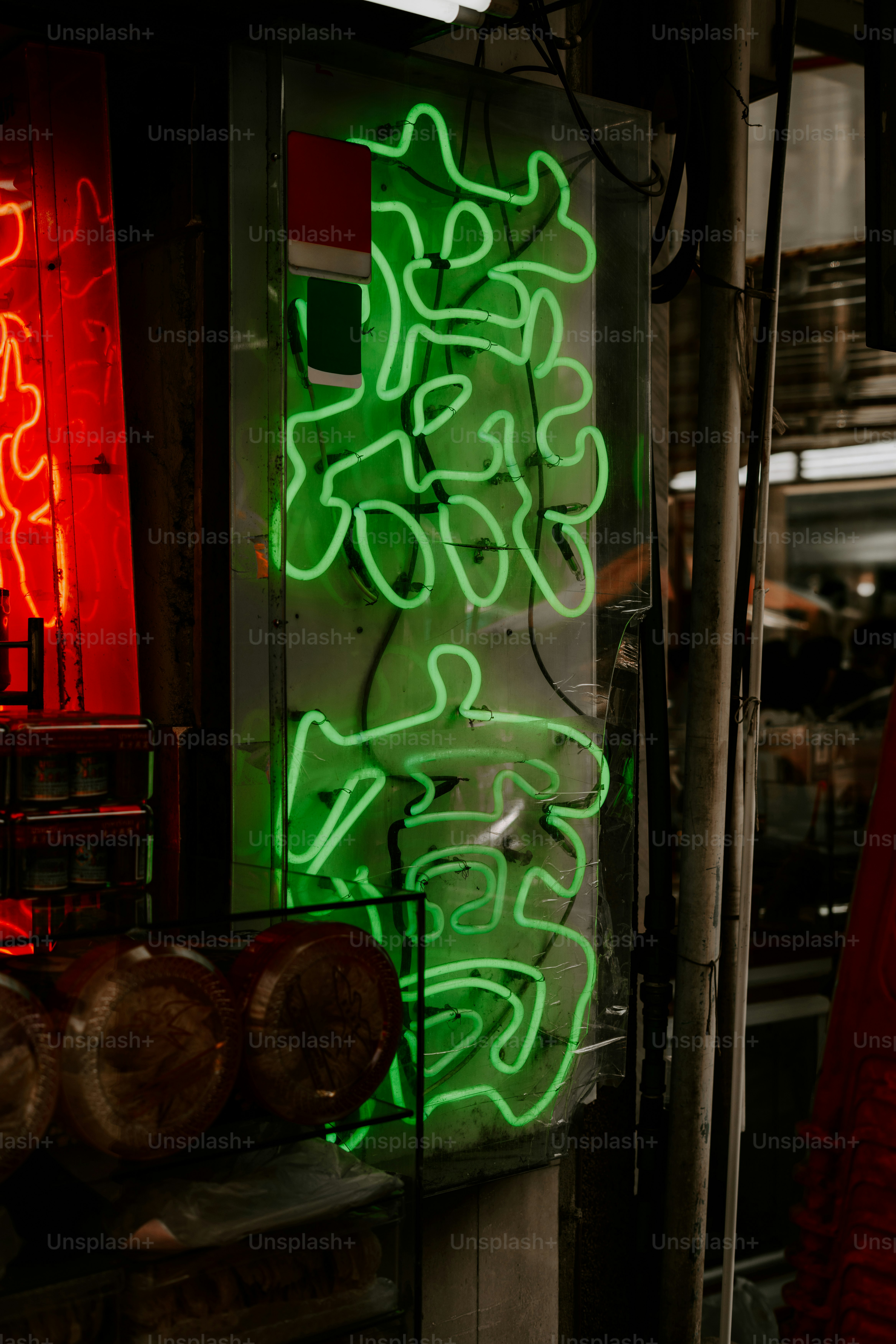 Neon signs glow with chinese characters.