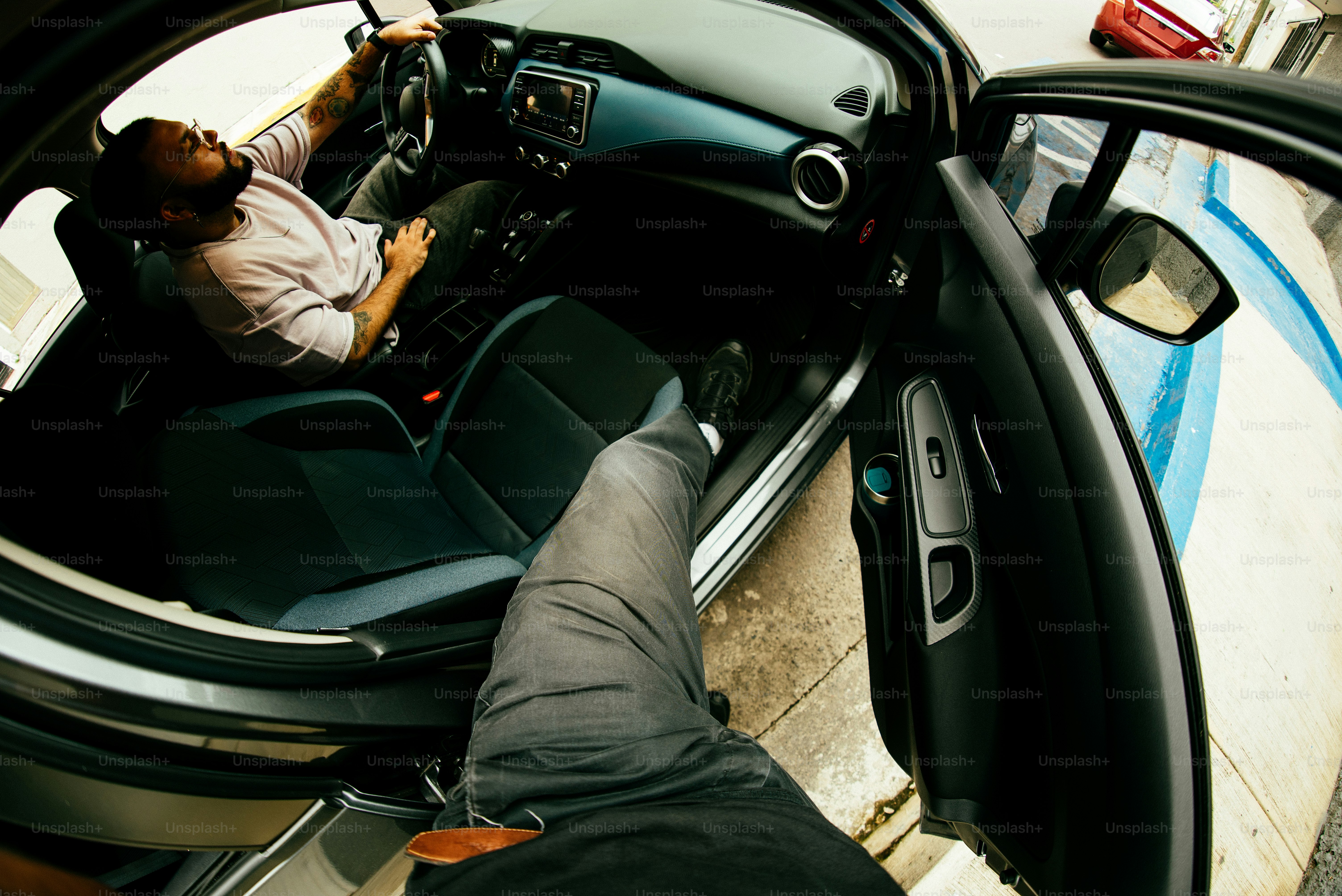 A man is shot inside a car.