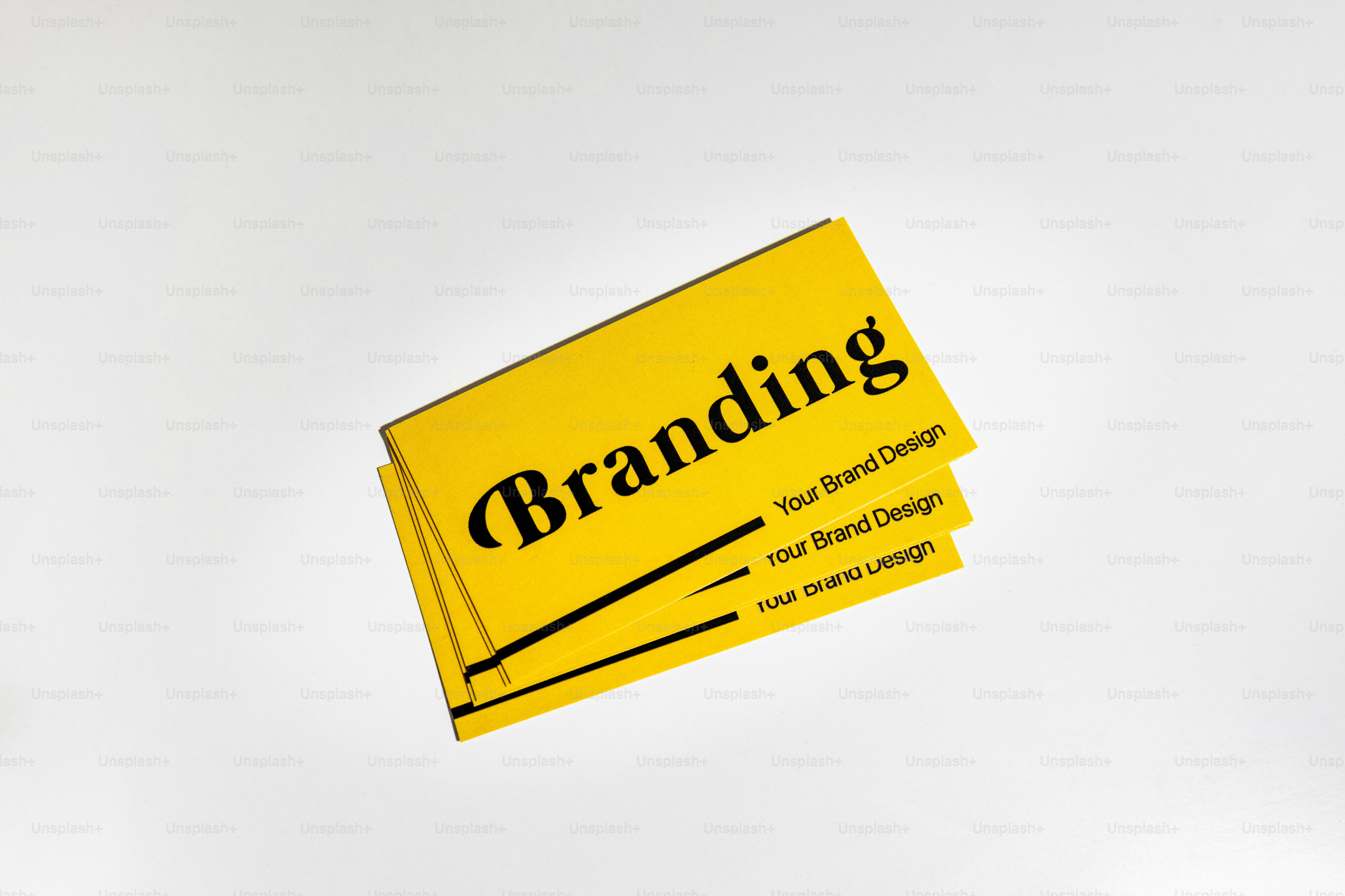 Branding concept on a stack of yellow cards.