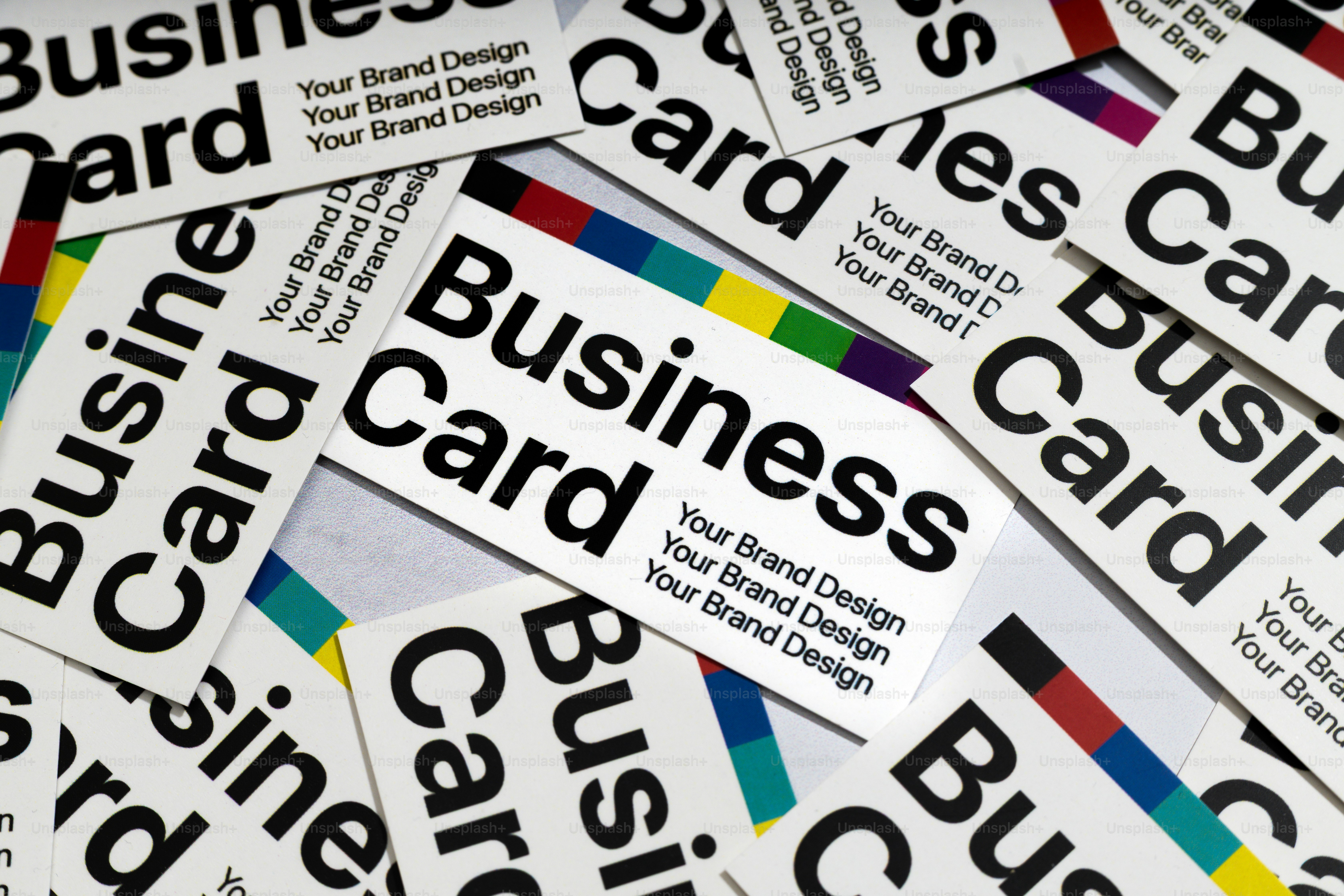 Business cards are scattered and overlapping.