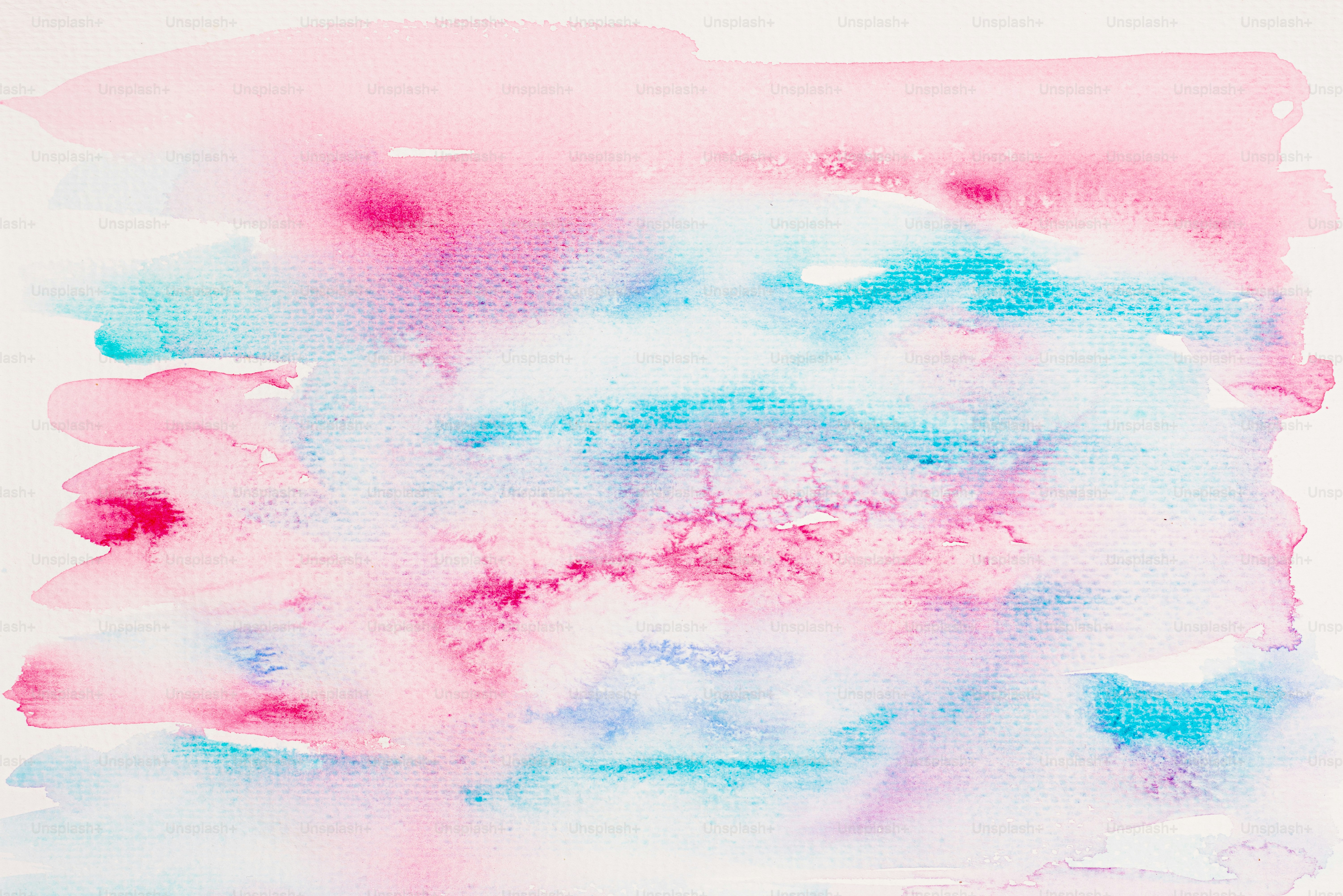 Aquarellfarben in Rosa, Blau und Lila.