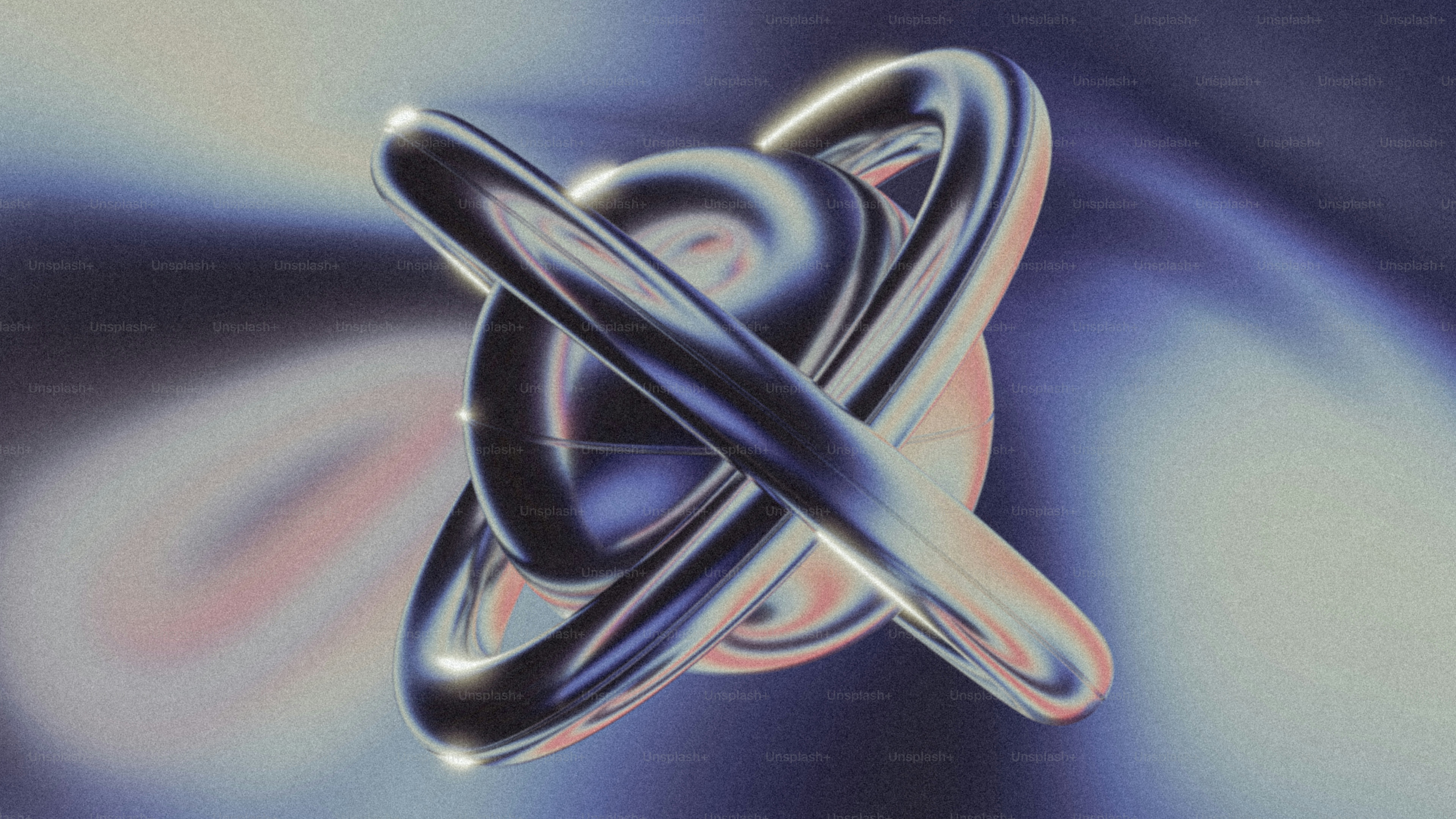 Eine glänzende, abstrakte Form vor einem verschwommenen Hintergrund.