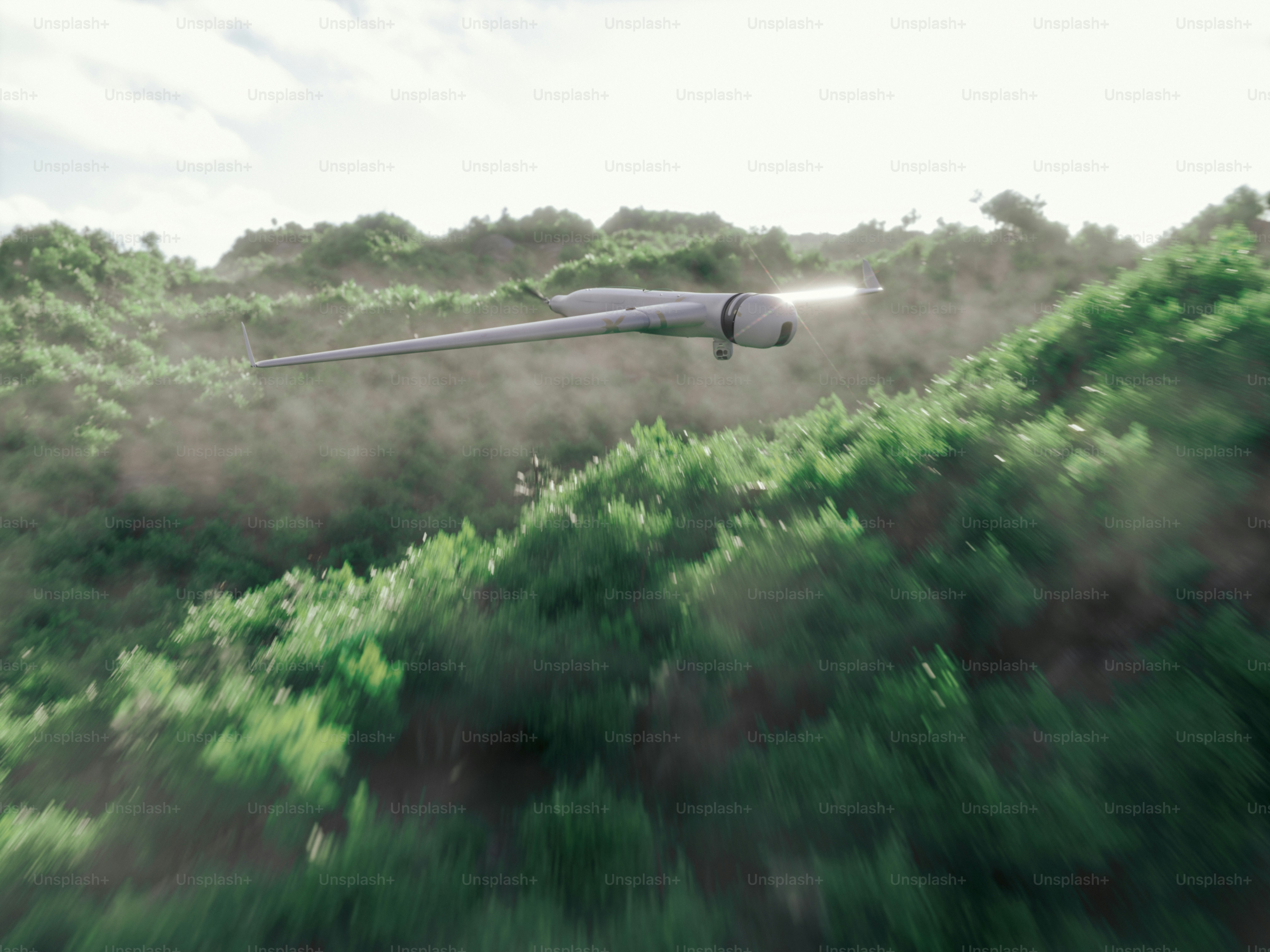 A futuristic aircraft flies over green hills.