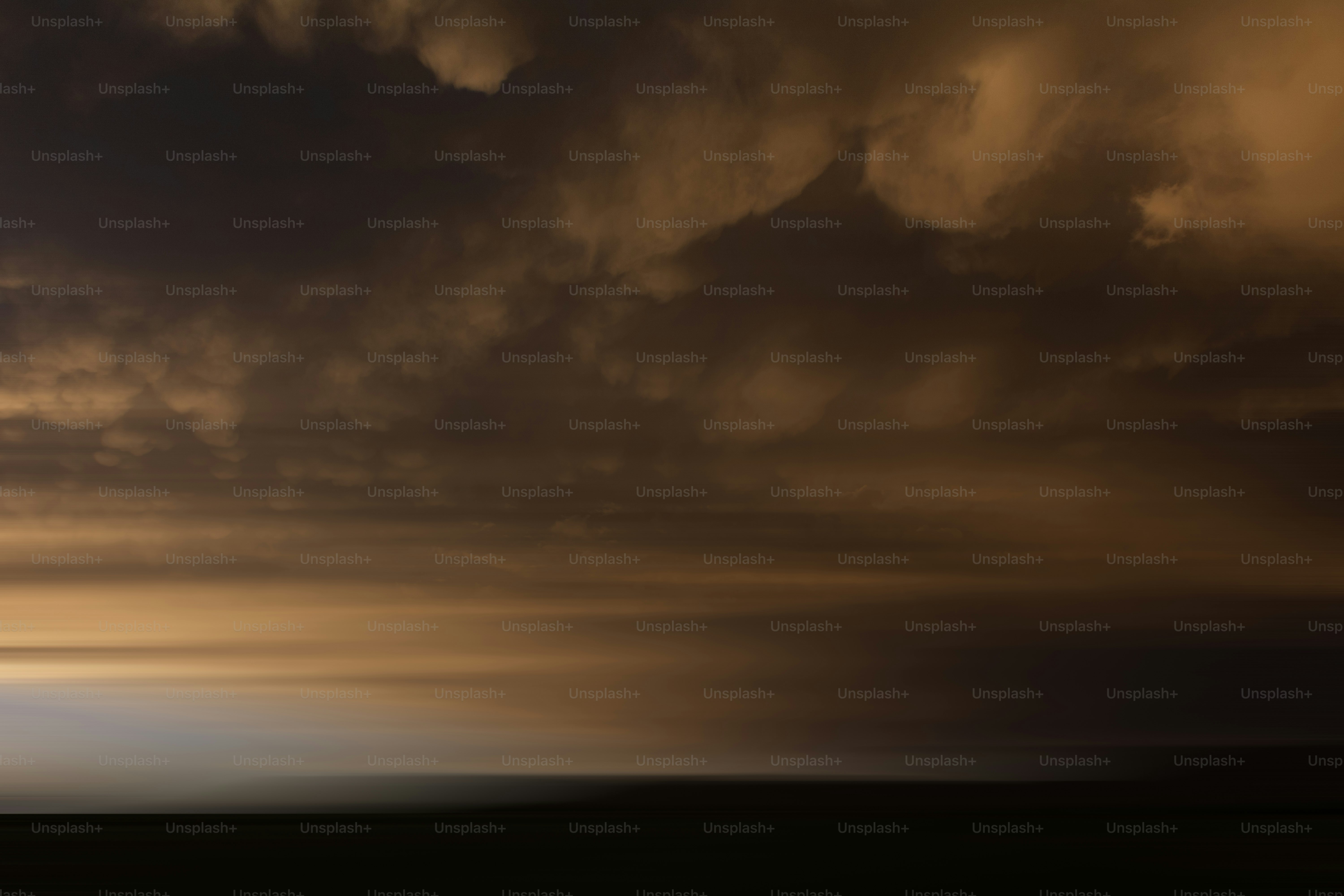 Dramatic, orange-tinged clouds dominate the sky.