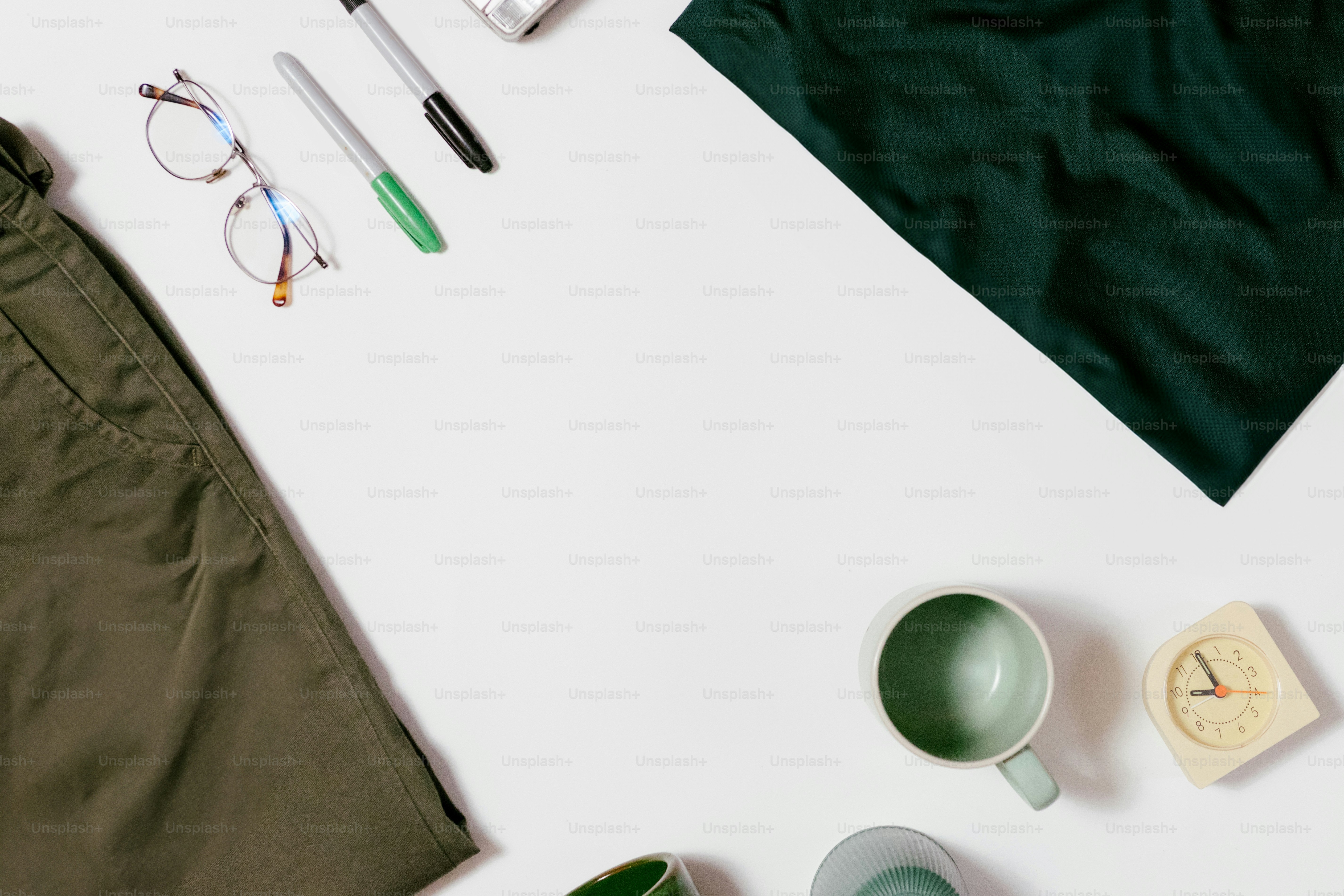 Essentials laid out on a white surface