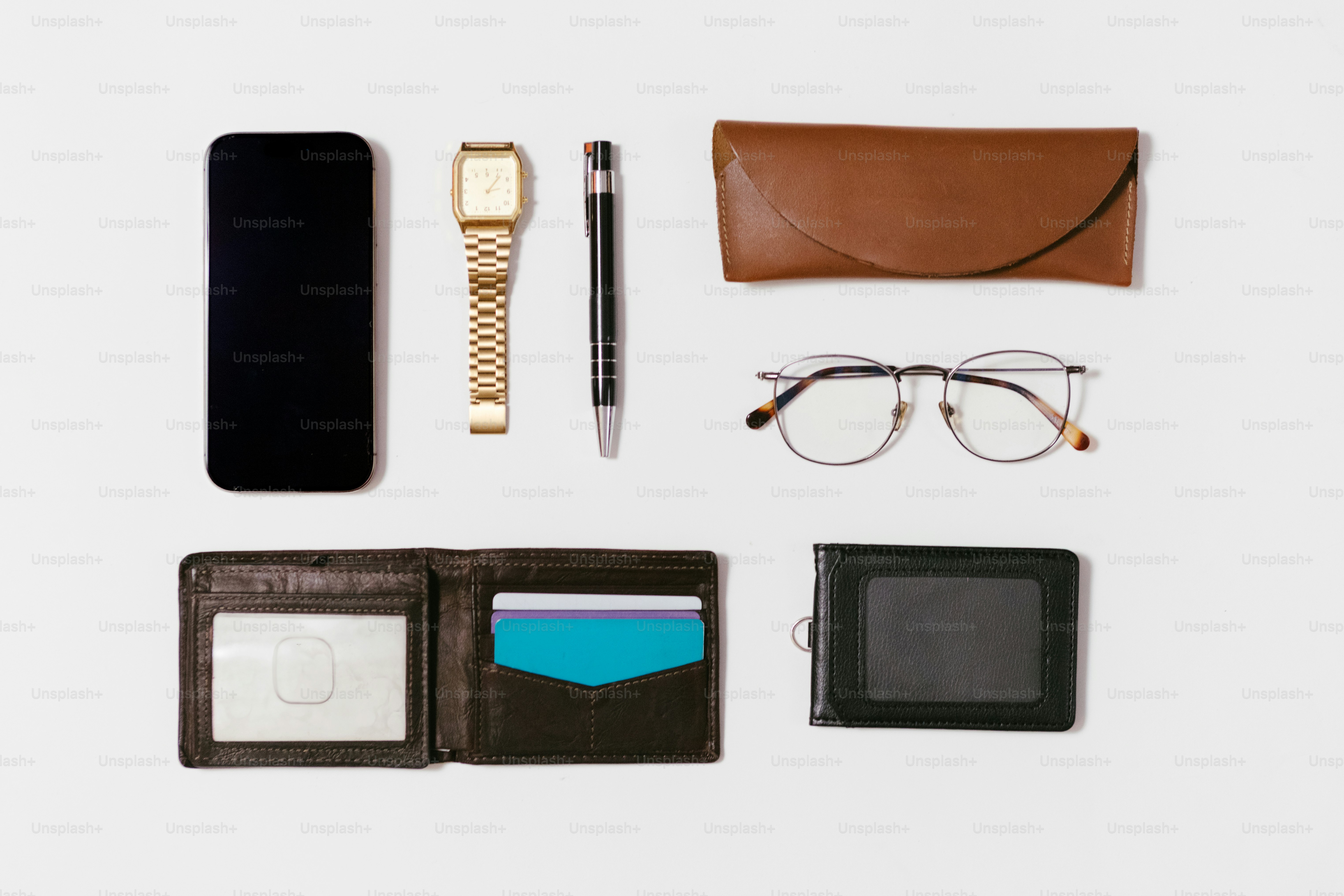 Essentials: phone, watch, glasses, wallet, and pen.
