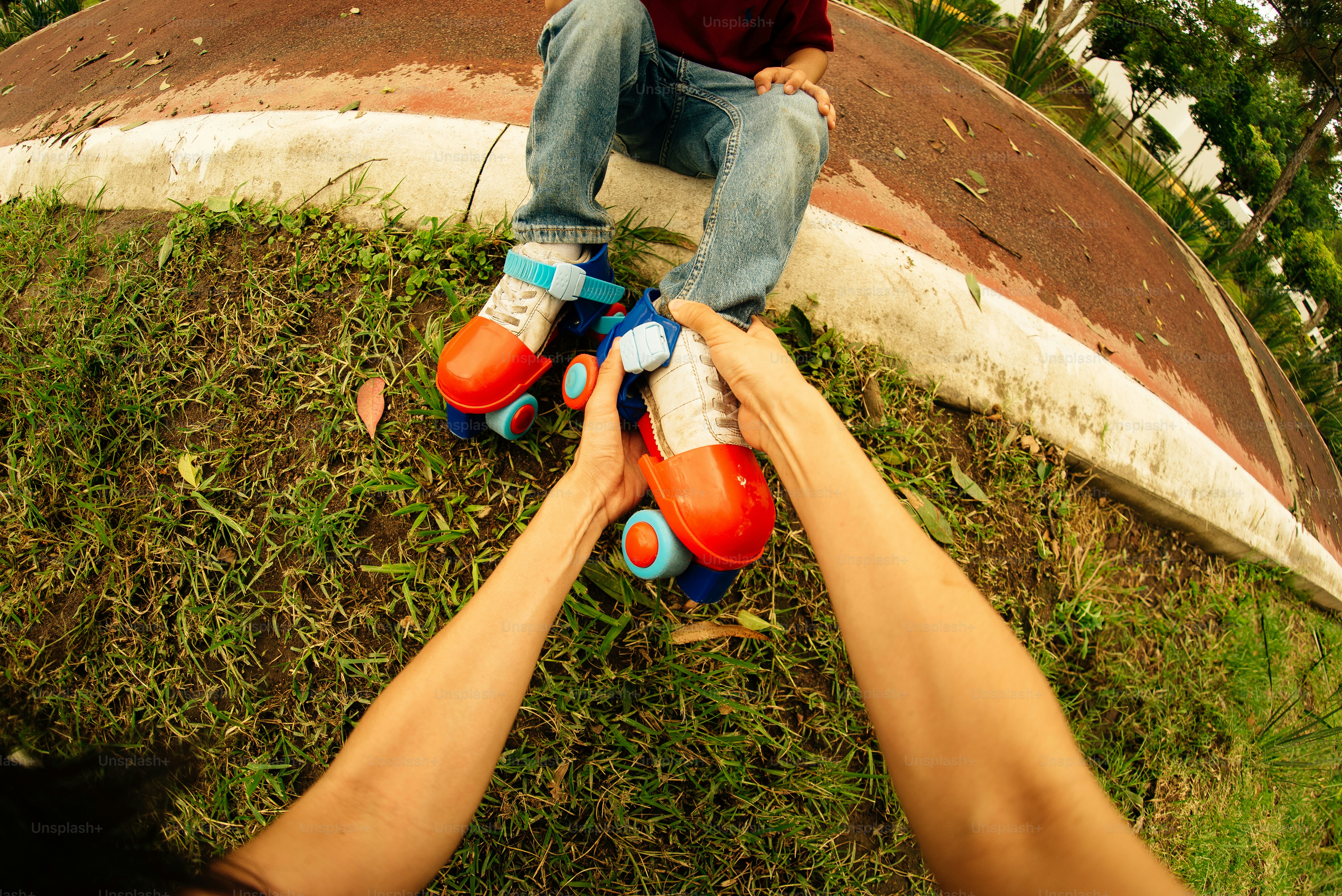 Helping someone with roller skates.