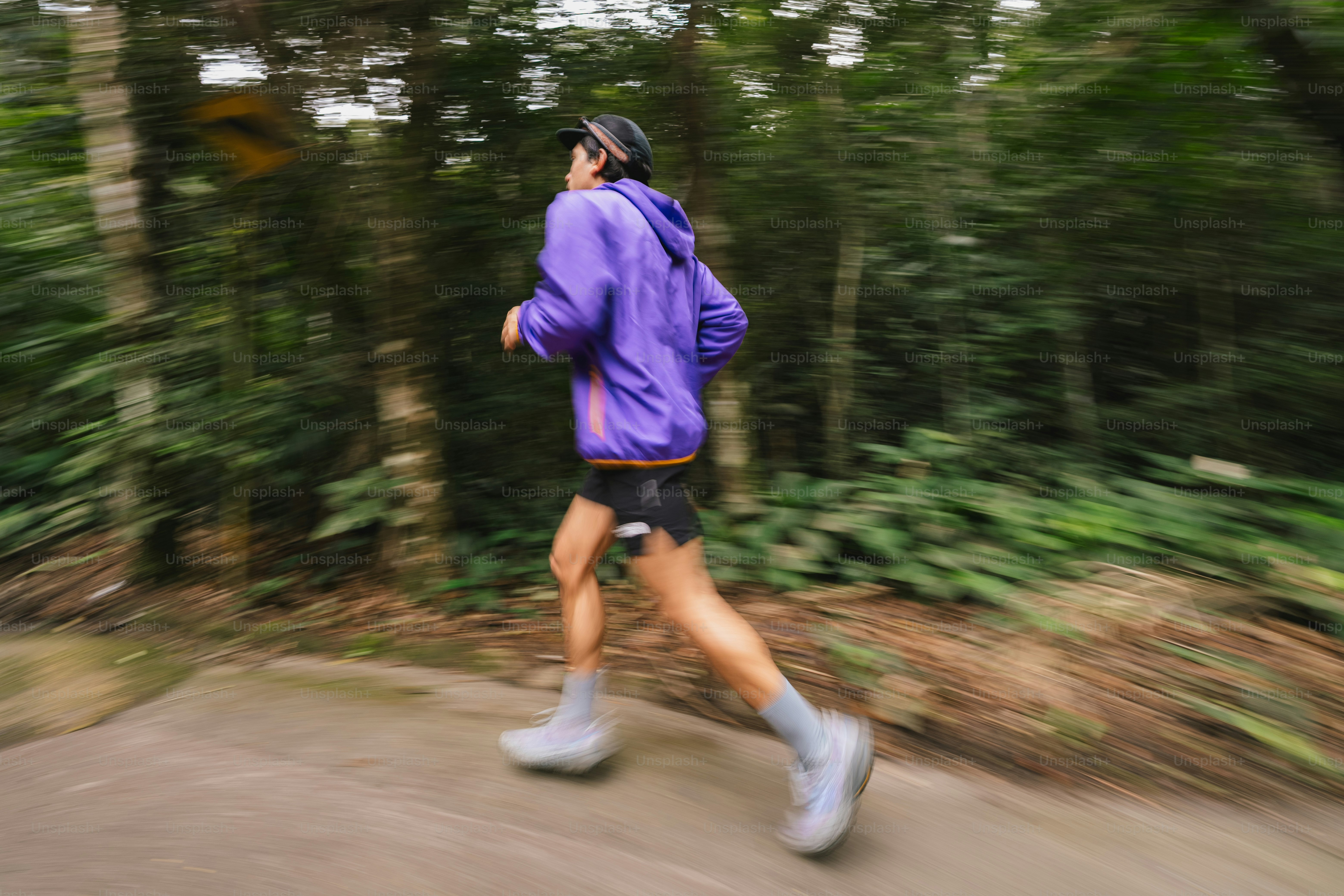 A person runs through a forest. photo – Fitness Image on Unsplash
