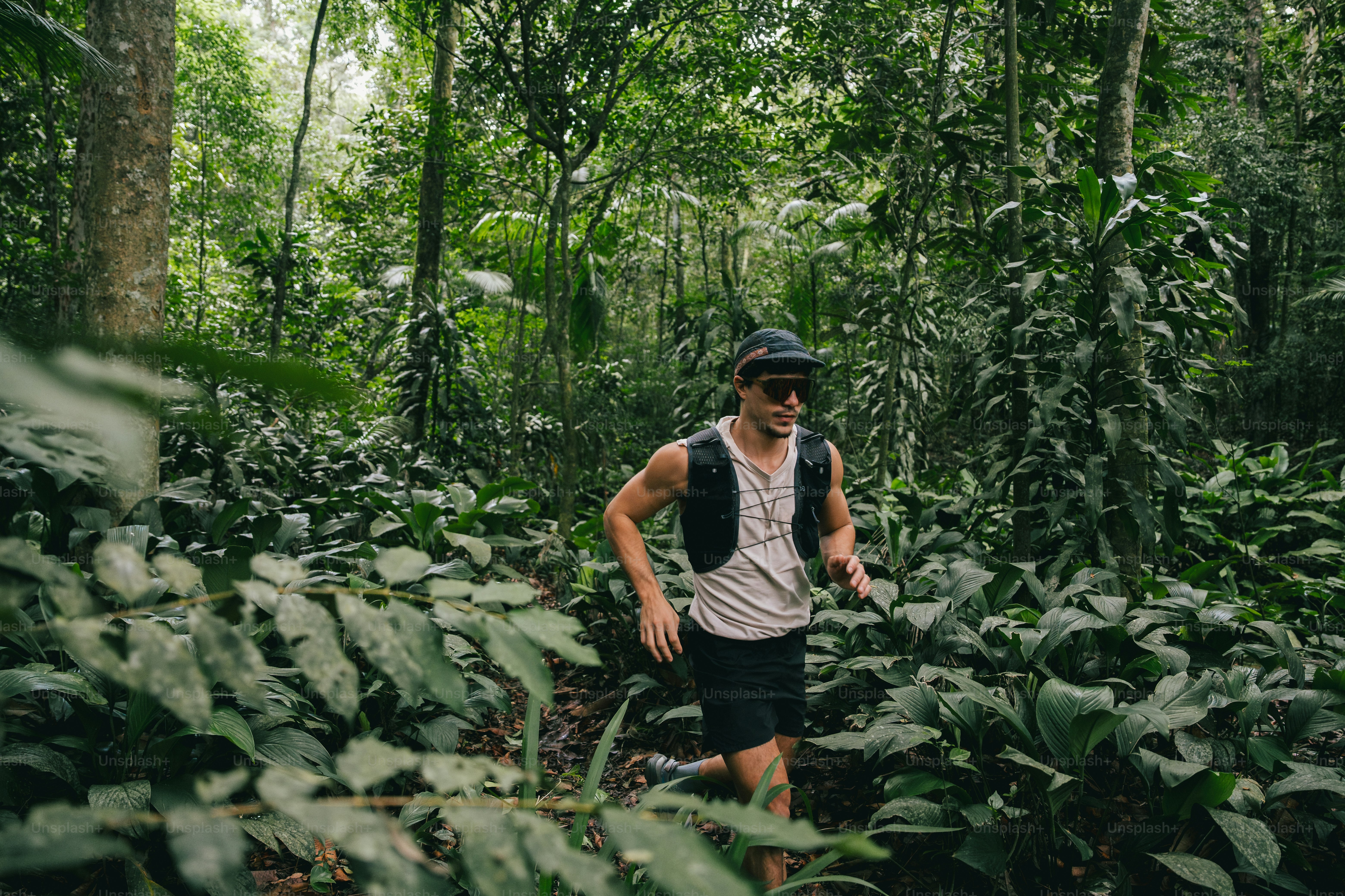 Man runs through a forest trail. photo – Sport Image on Unsplash