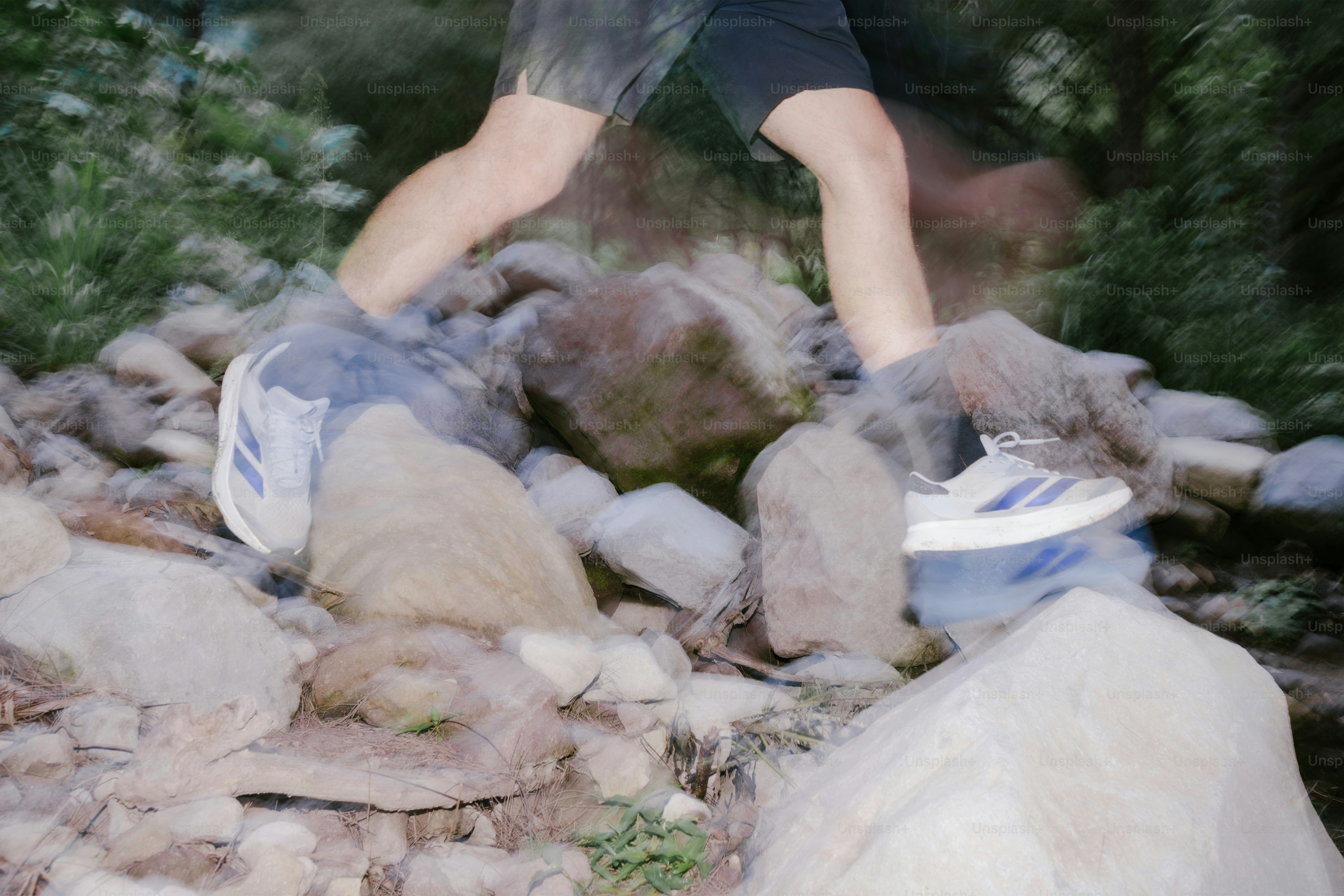 Person jumps on rocks near water with motion blur. photo – Fitness ...