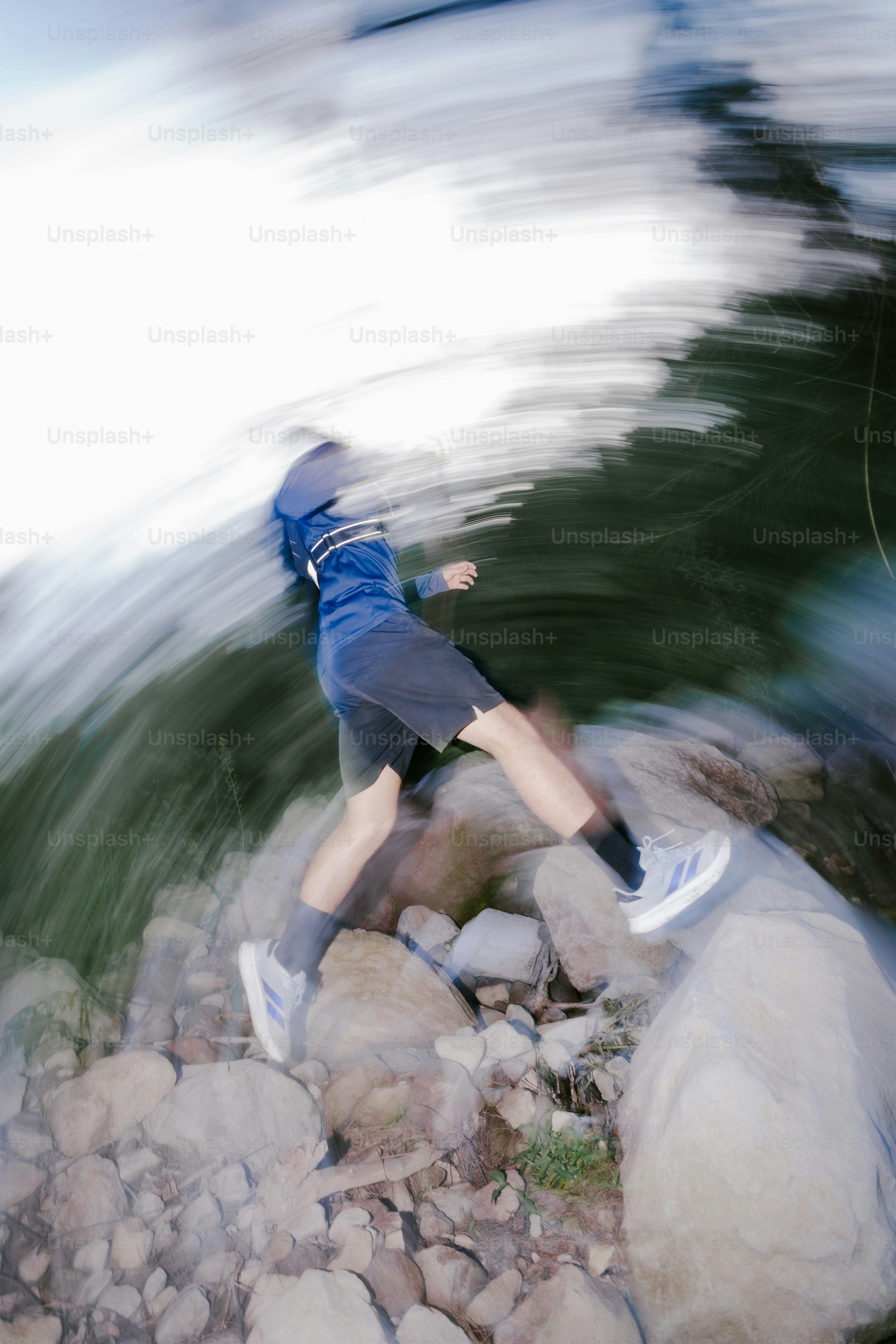 Person jumps on rocks near water with motion blur. photo – Fitness ...