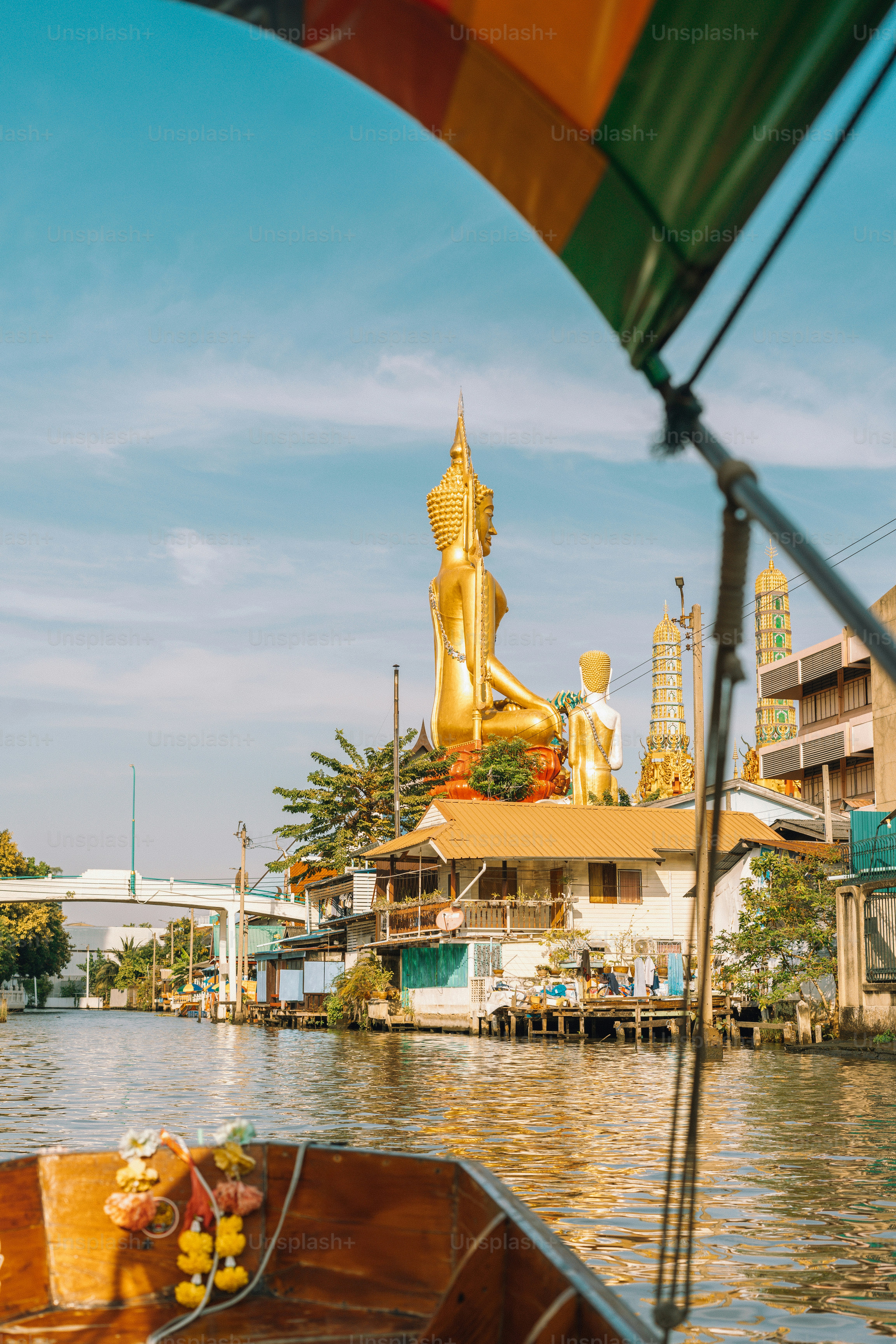 Boat ride with golden buddha statue in sight