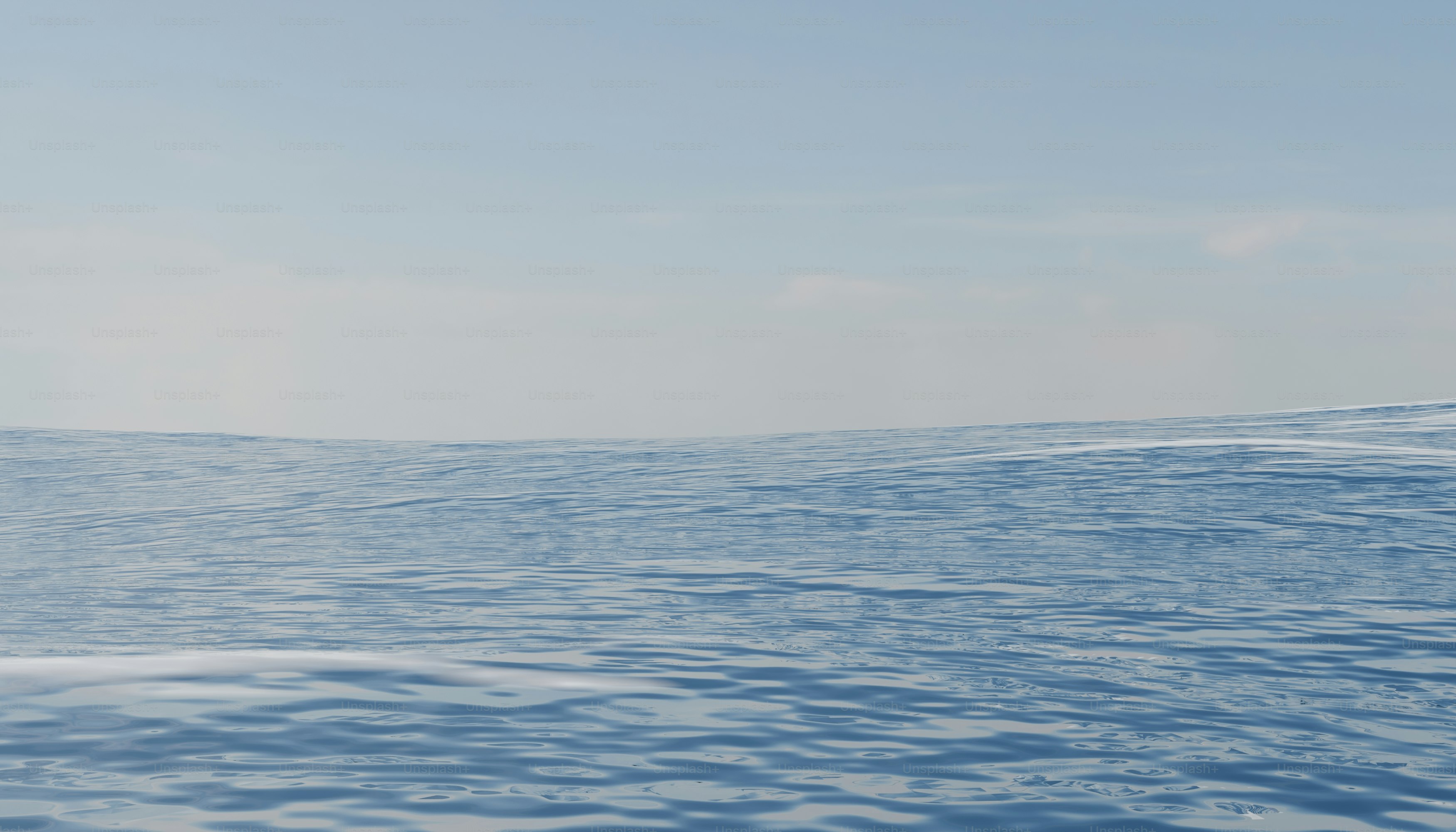 Blue snowfield extends to a clear sky.