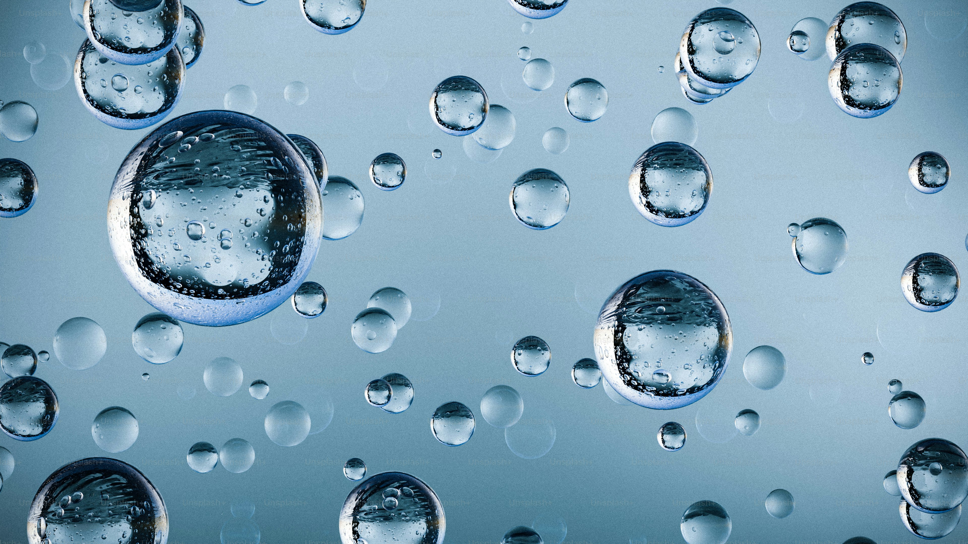 Water droplets float in a light blue background.