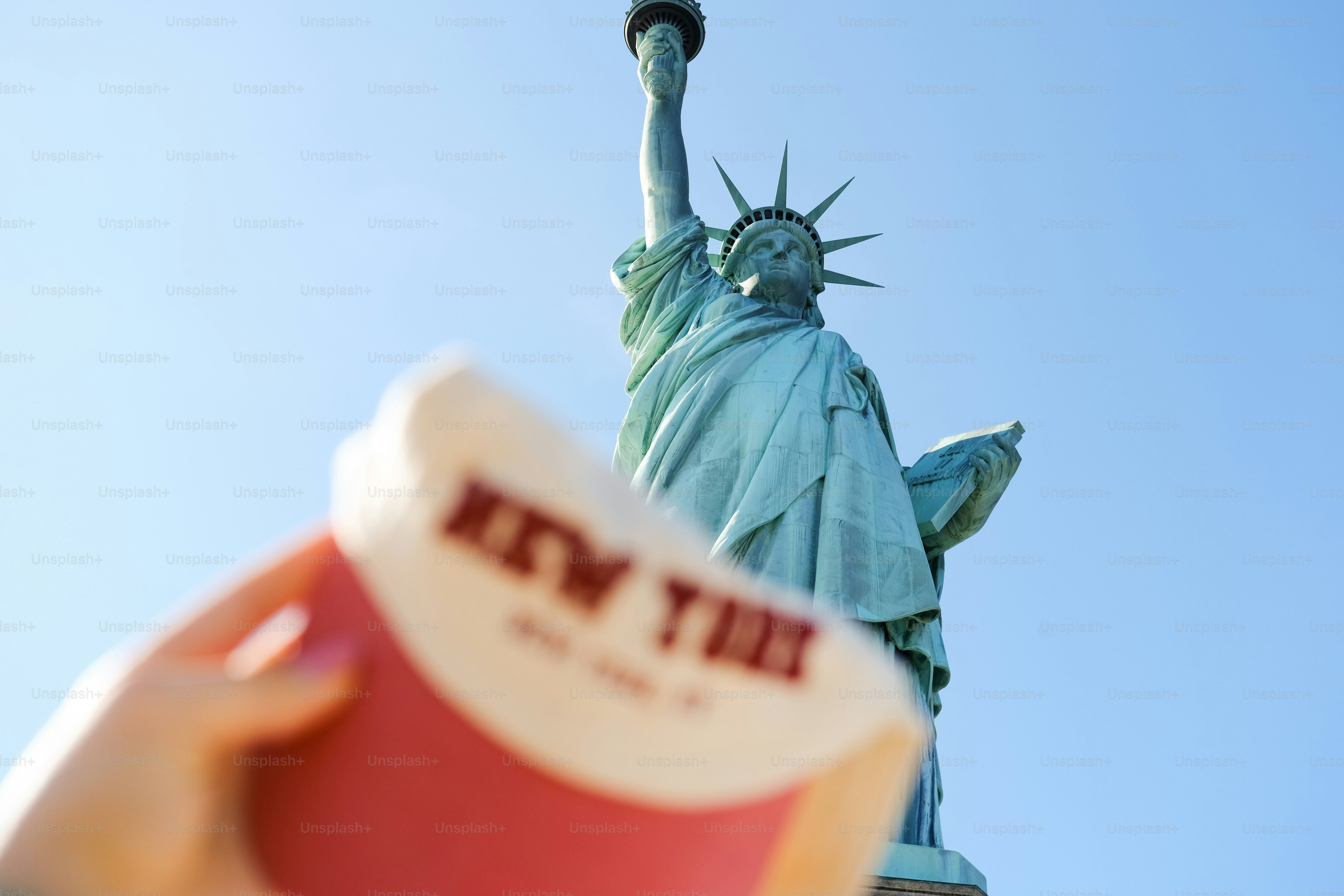 Statue of liberty with a "new york" souvenir.