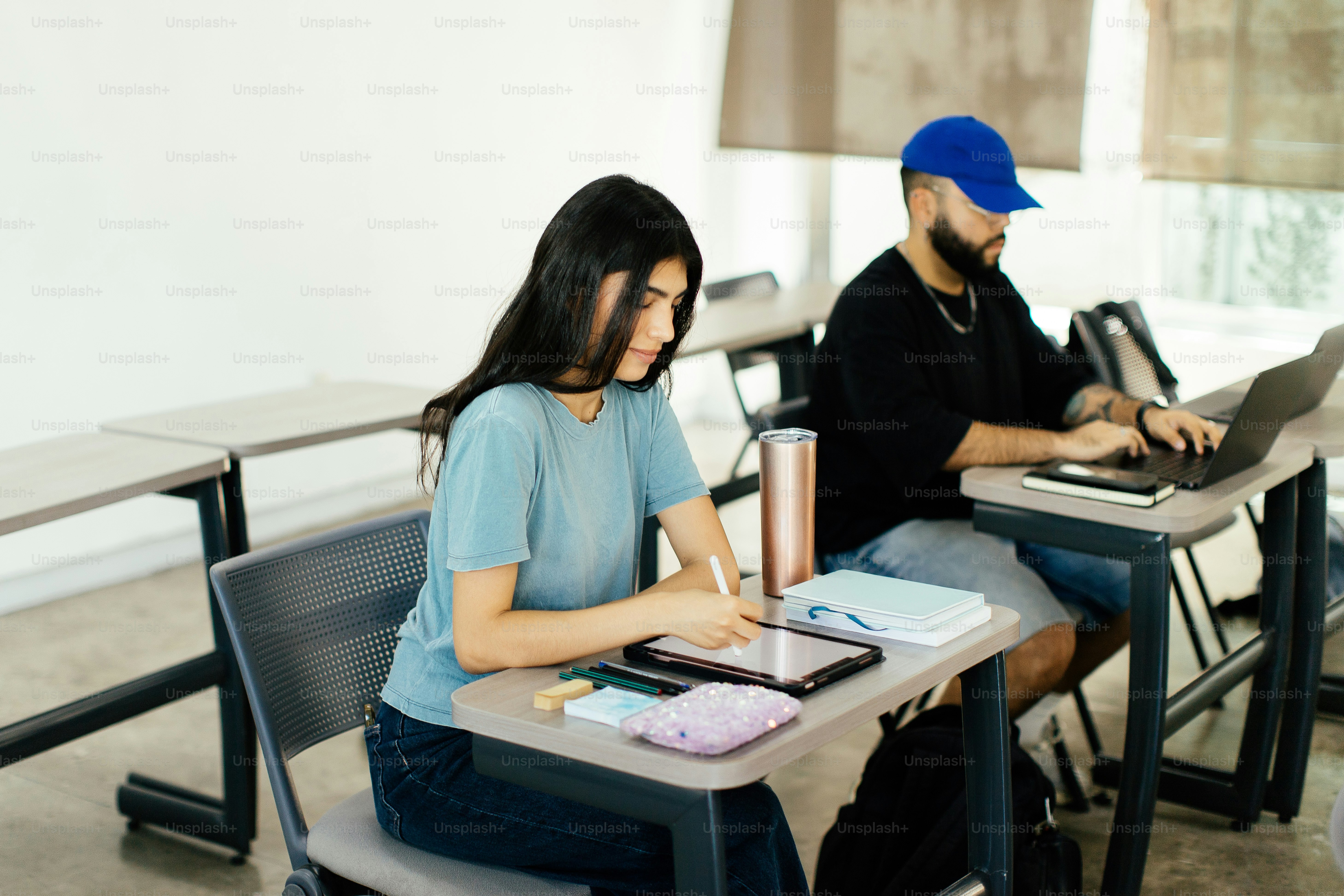 Students study in a classroom with laptops and notebooks. photo ...