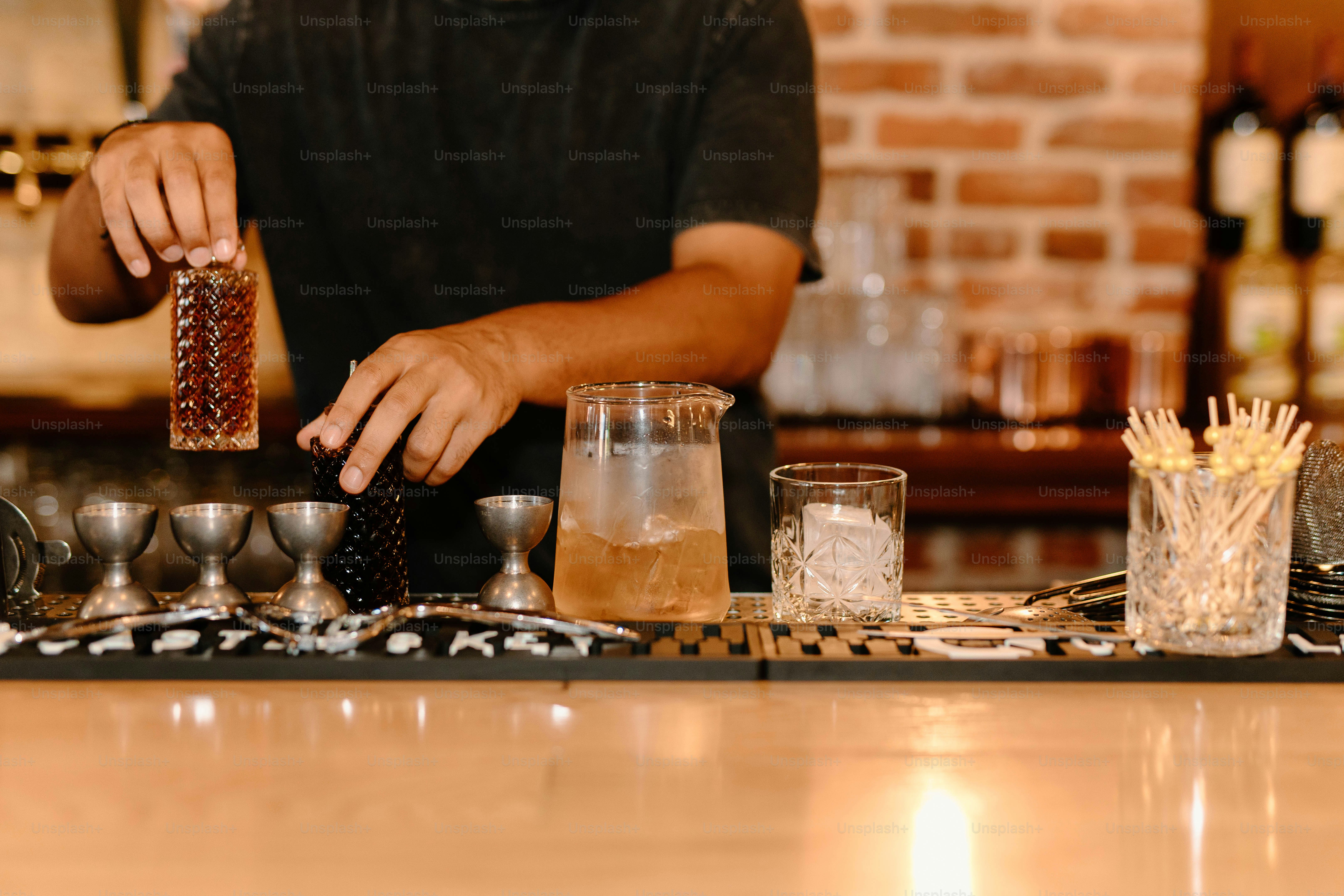 A bartender prepares a delicious cocktail.