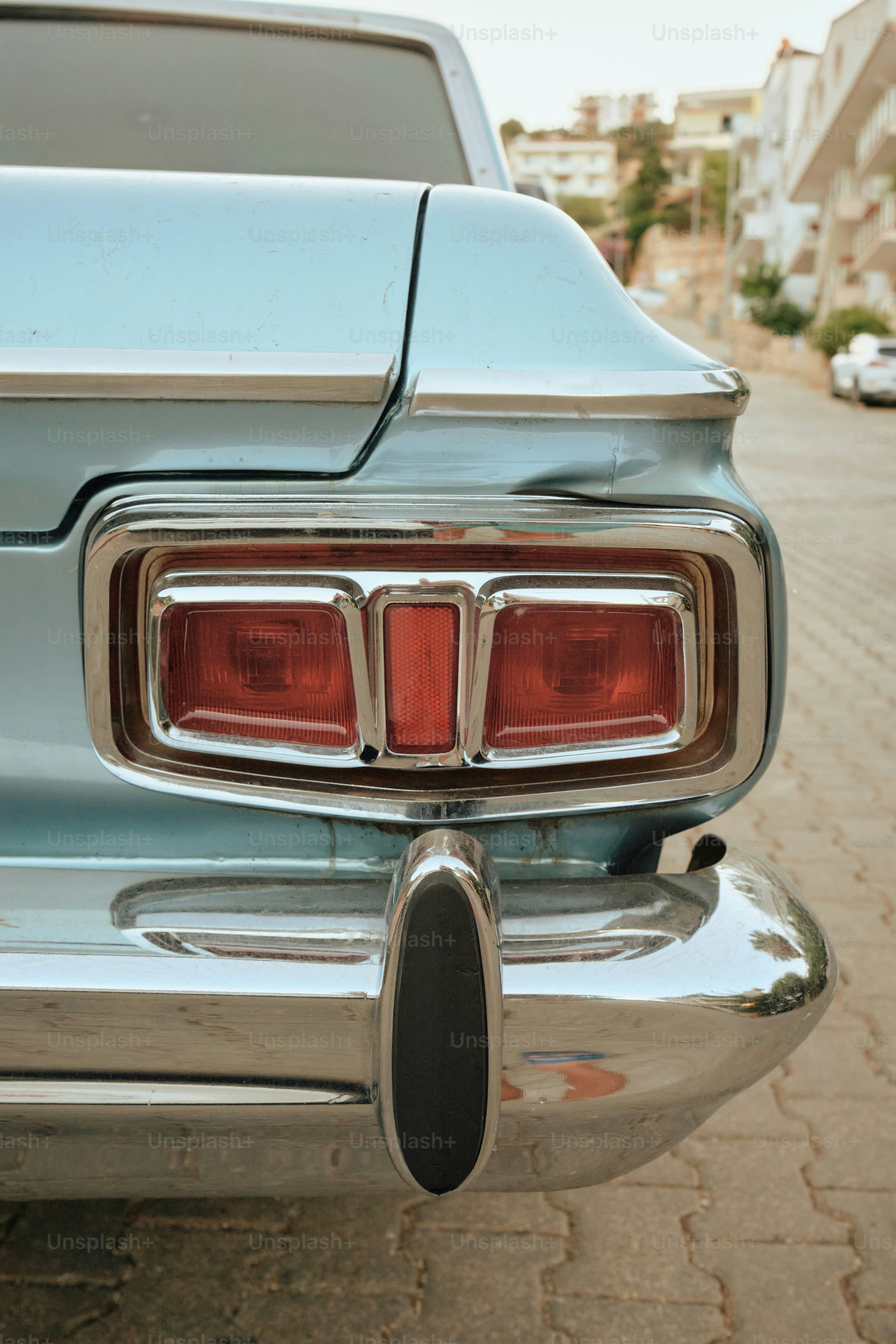 A close-up of a vintage car's taillight.