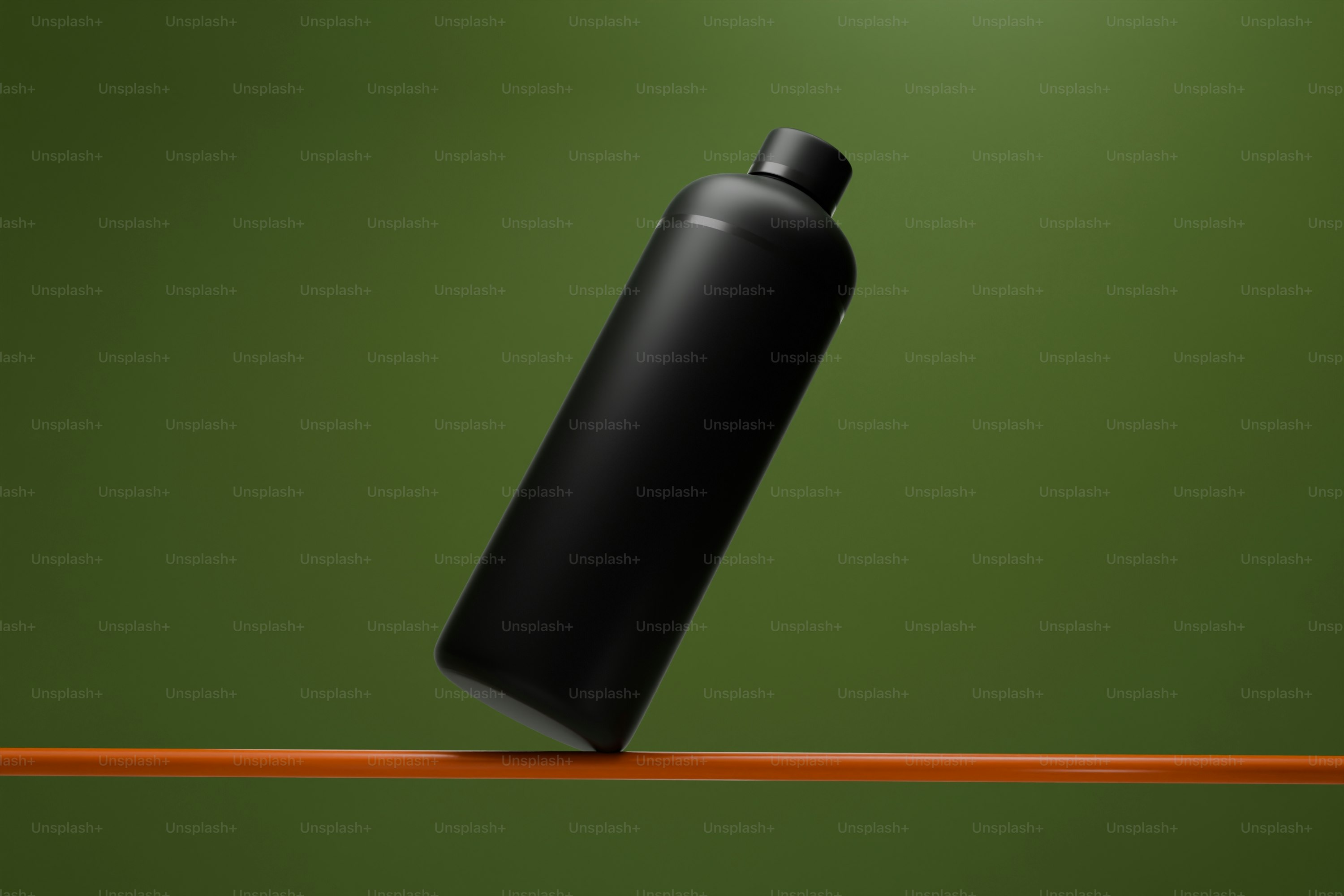 A black bottle balances on a rod.