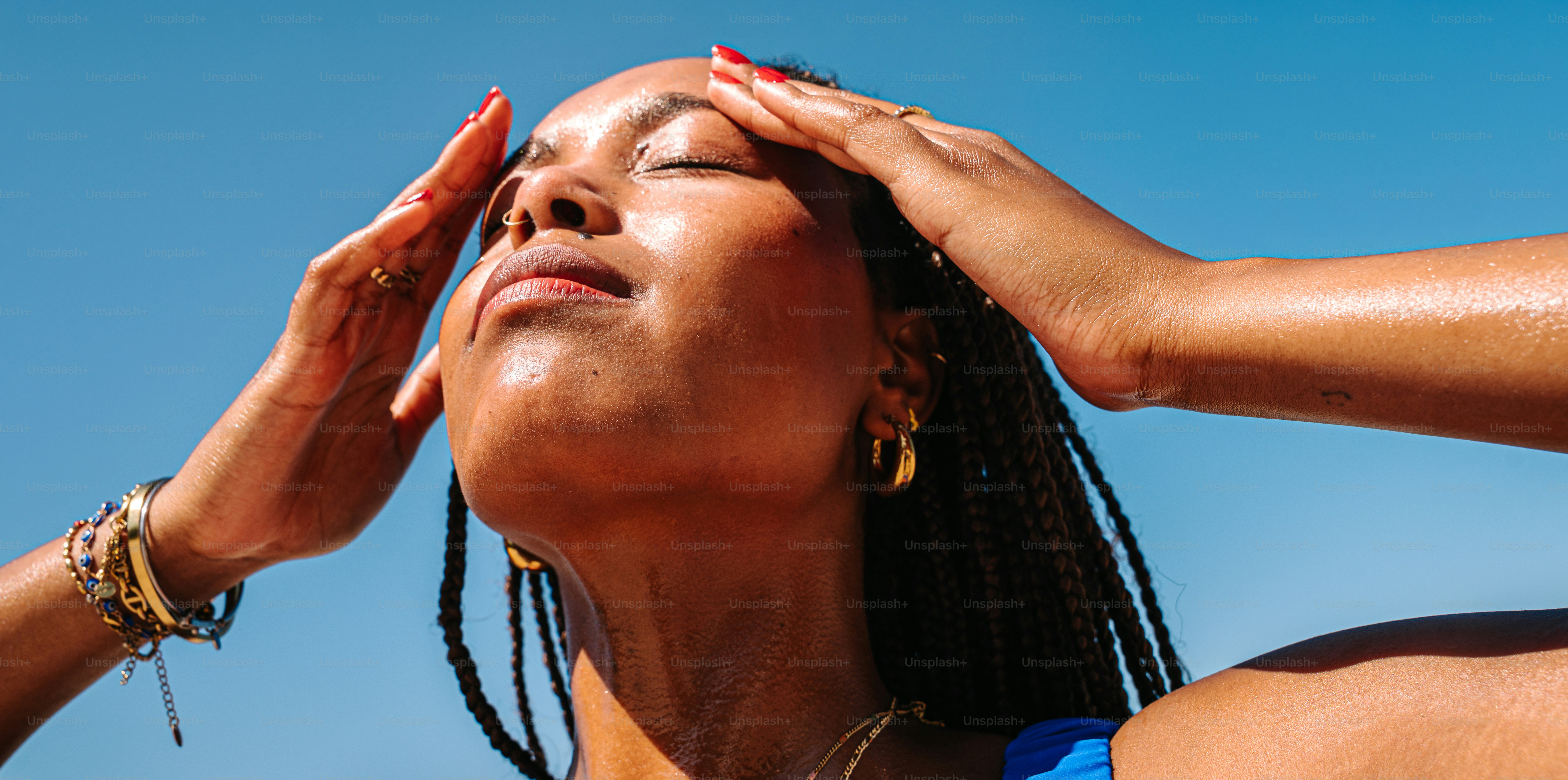 Woman enjoying sunlight with closed eyes