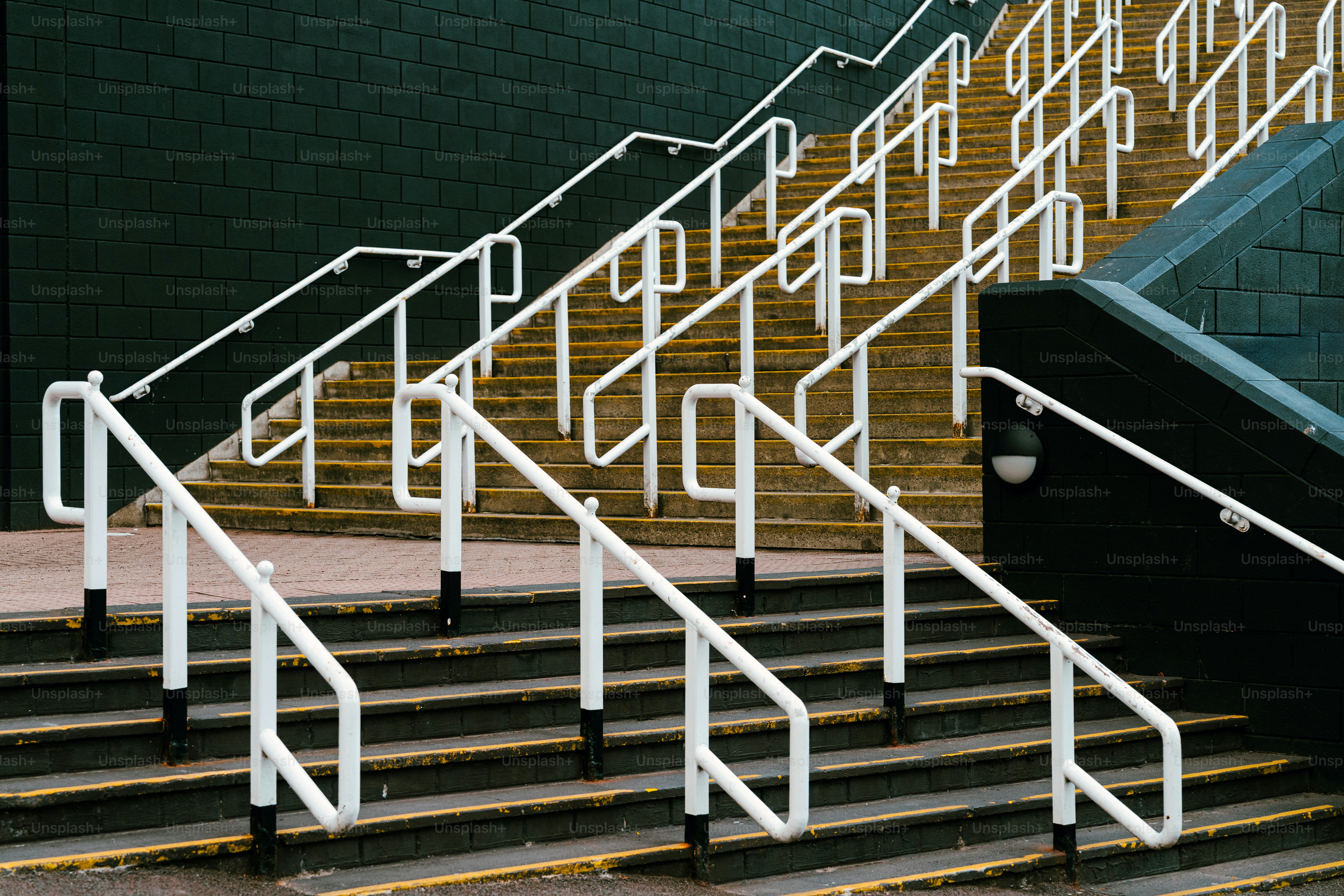 White railings lead up a set of stairs.