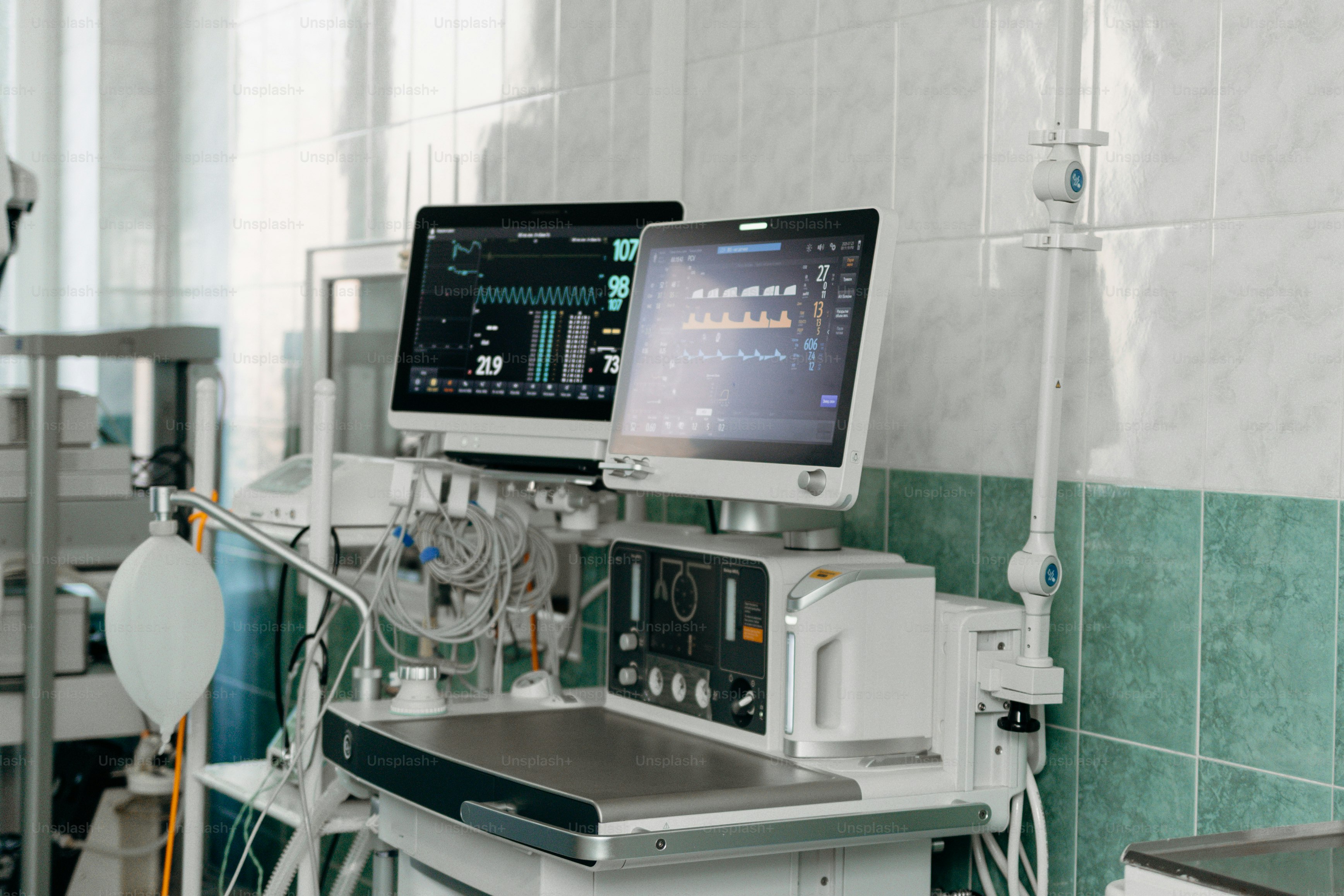 Medical monitors and equipment are shown in a hospital.