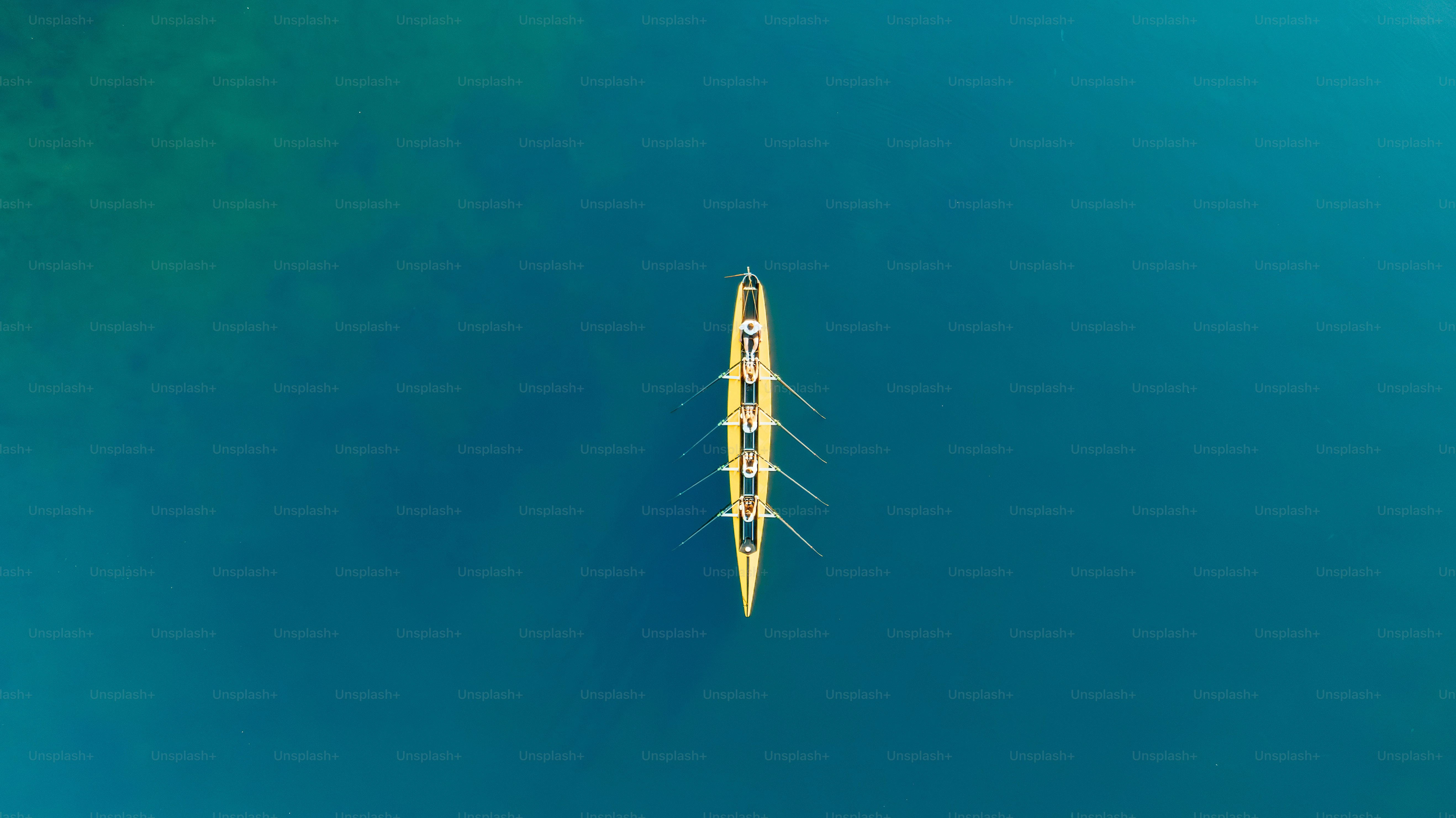 A rowing boat glides serenely across the water.