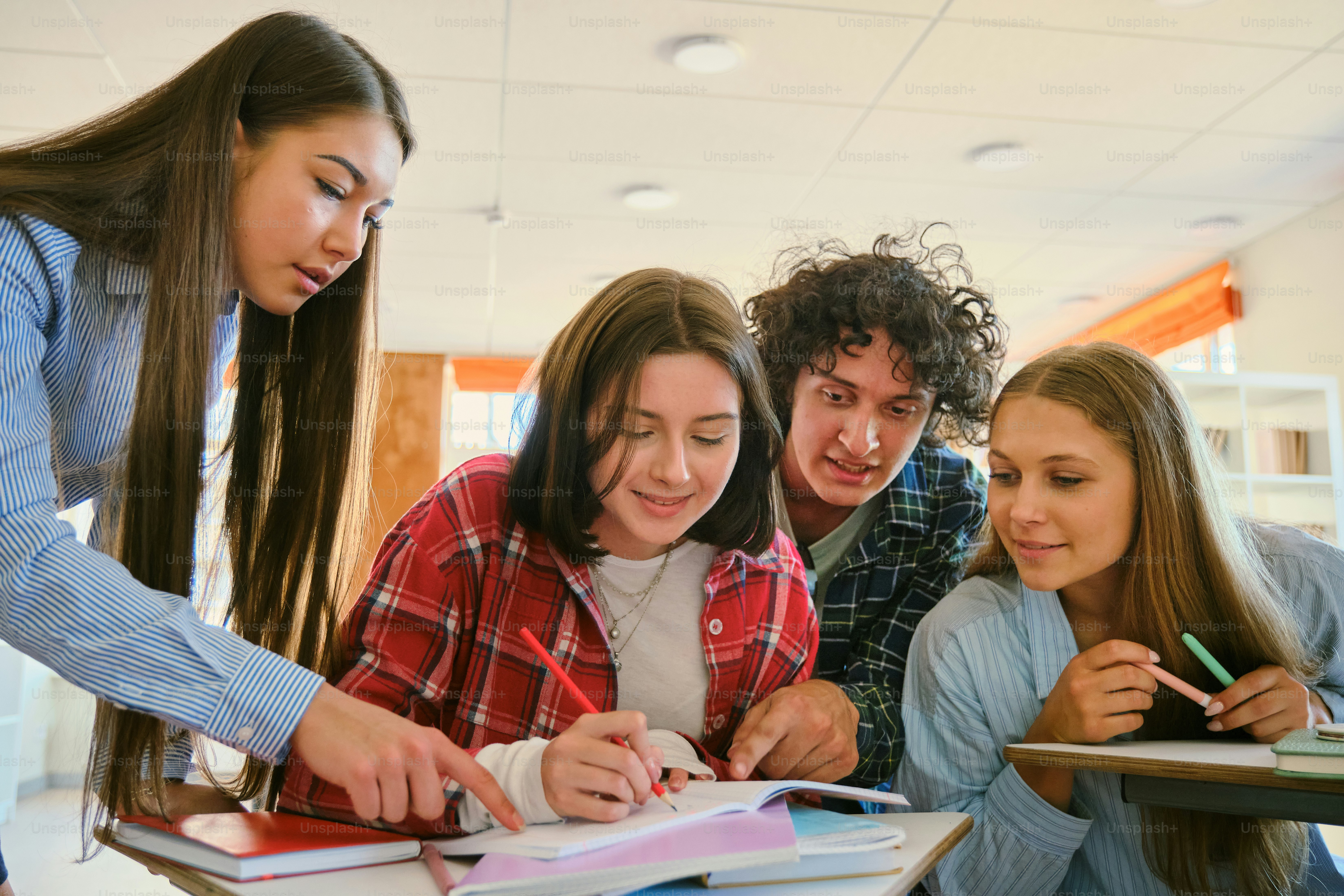 Students are collaborating and working together in a classroom. photo ...