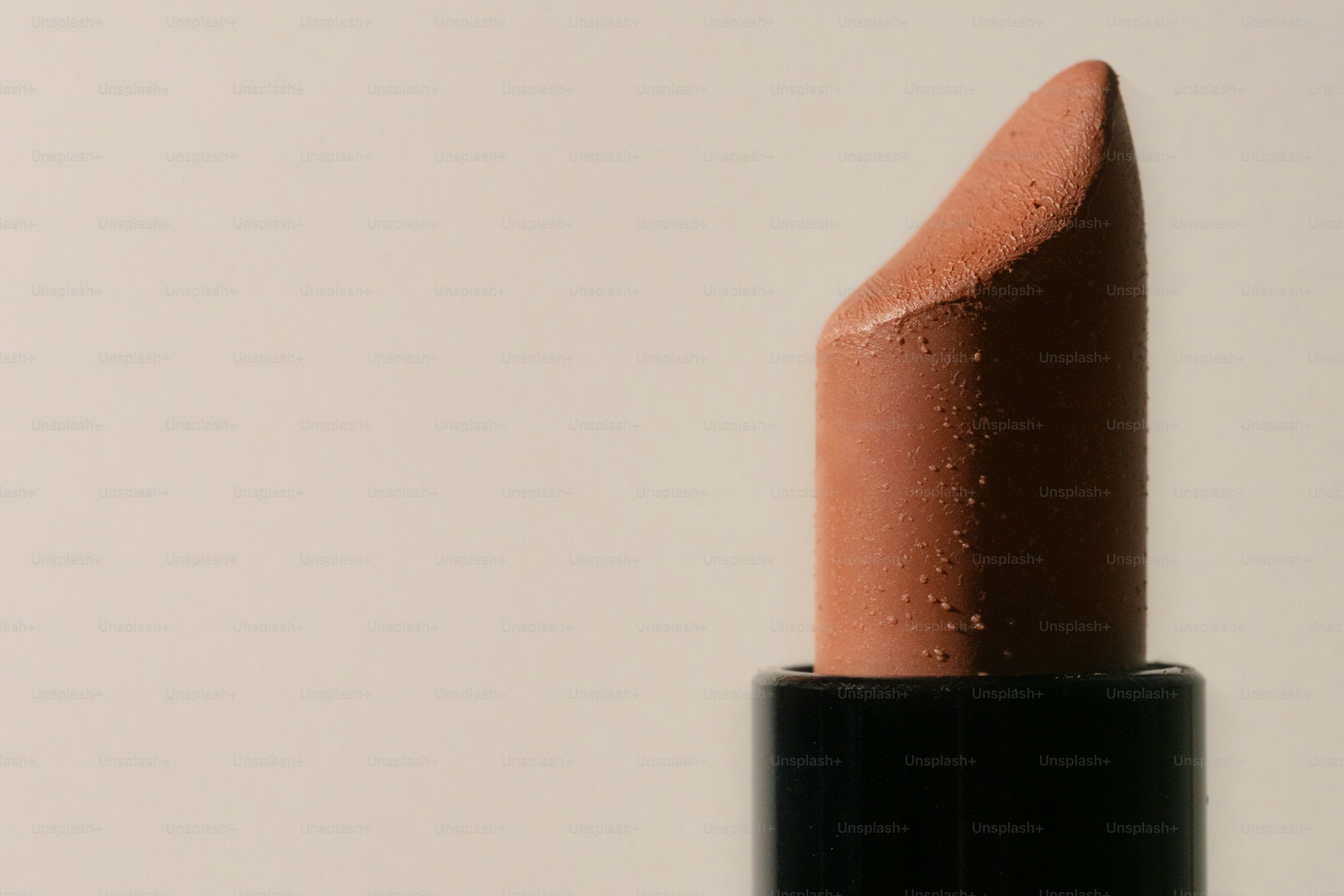 A close-up shot of a nude lipstick.
