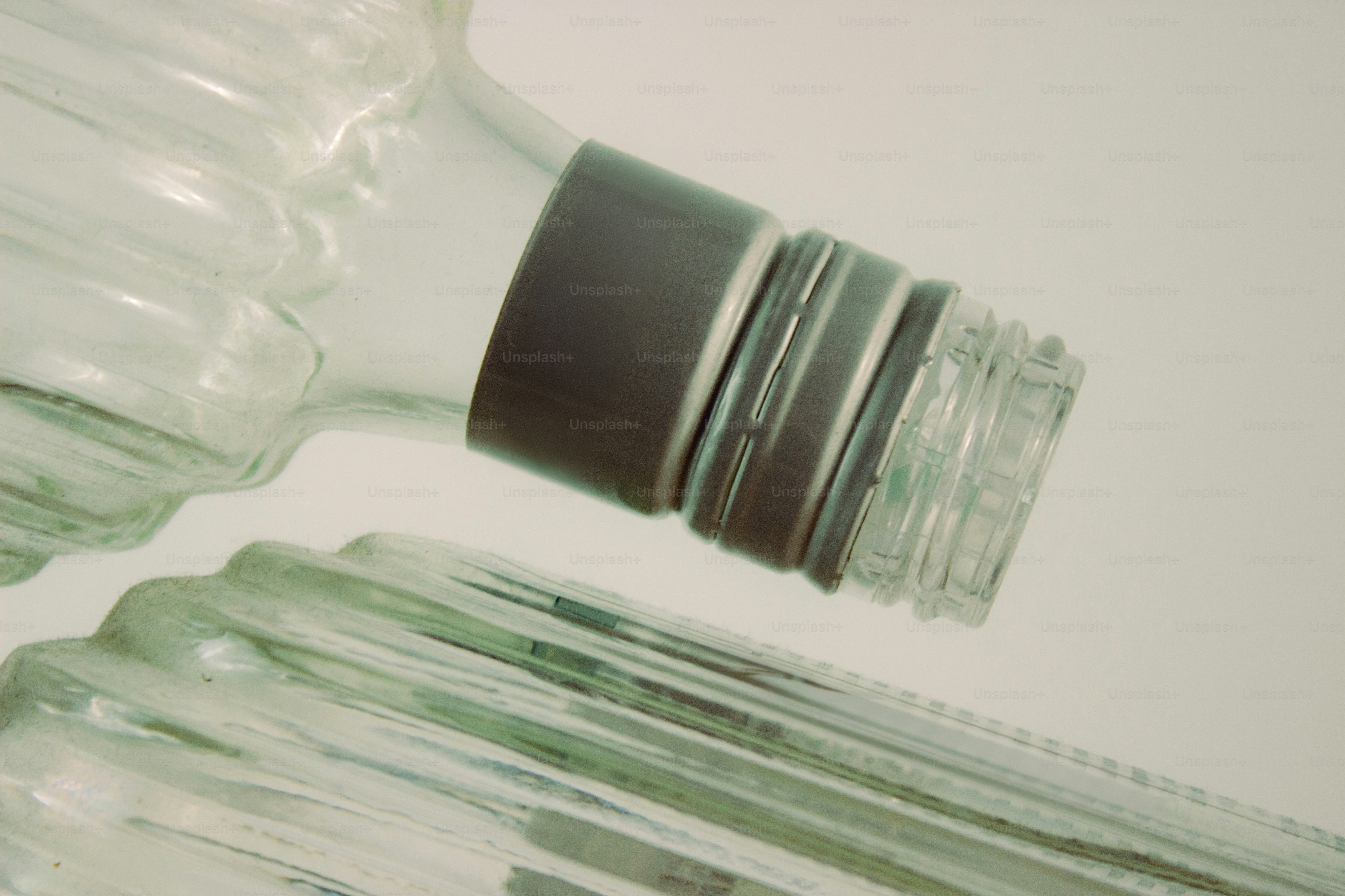 Bottles close-up, one with a dark band.