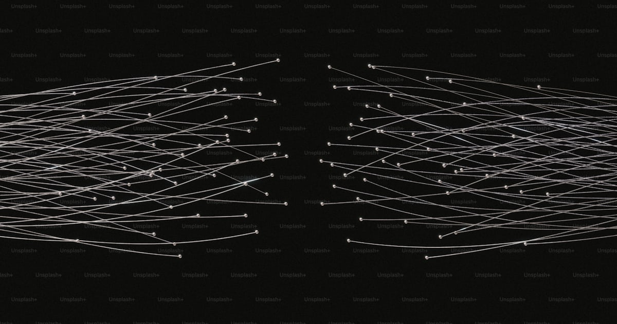 Optical Fibers Diverge Against A Black Background Photo
