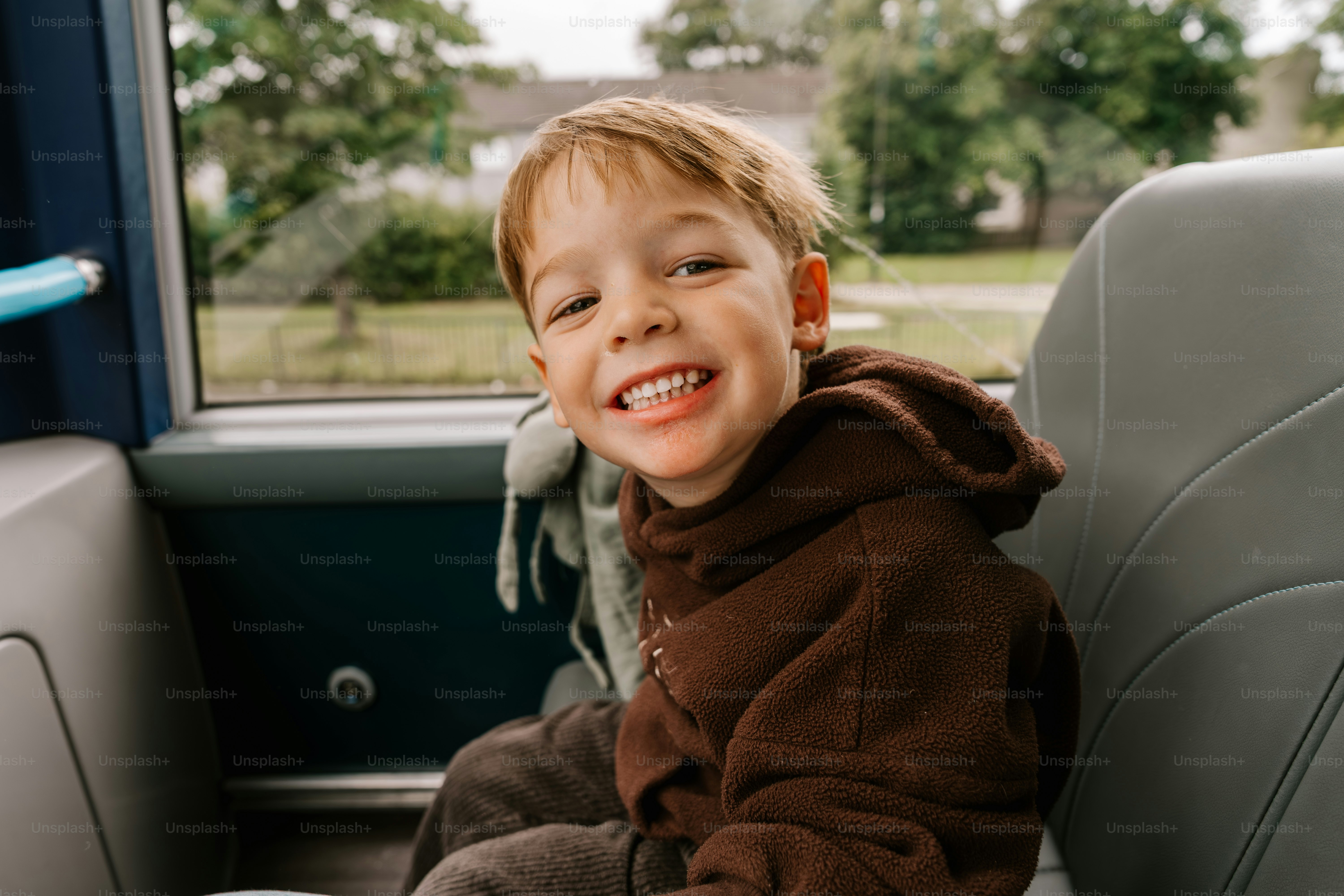 Happy child smiling and looking at the camera.