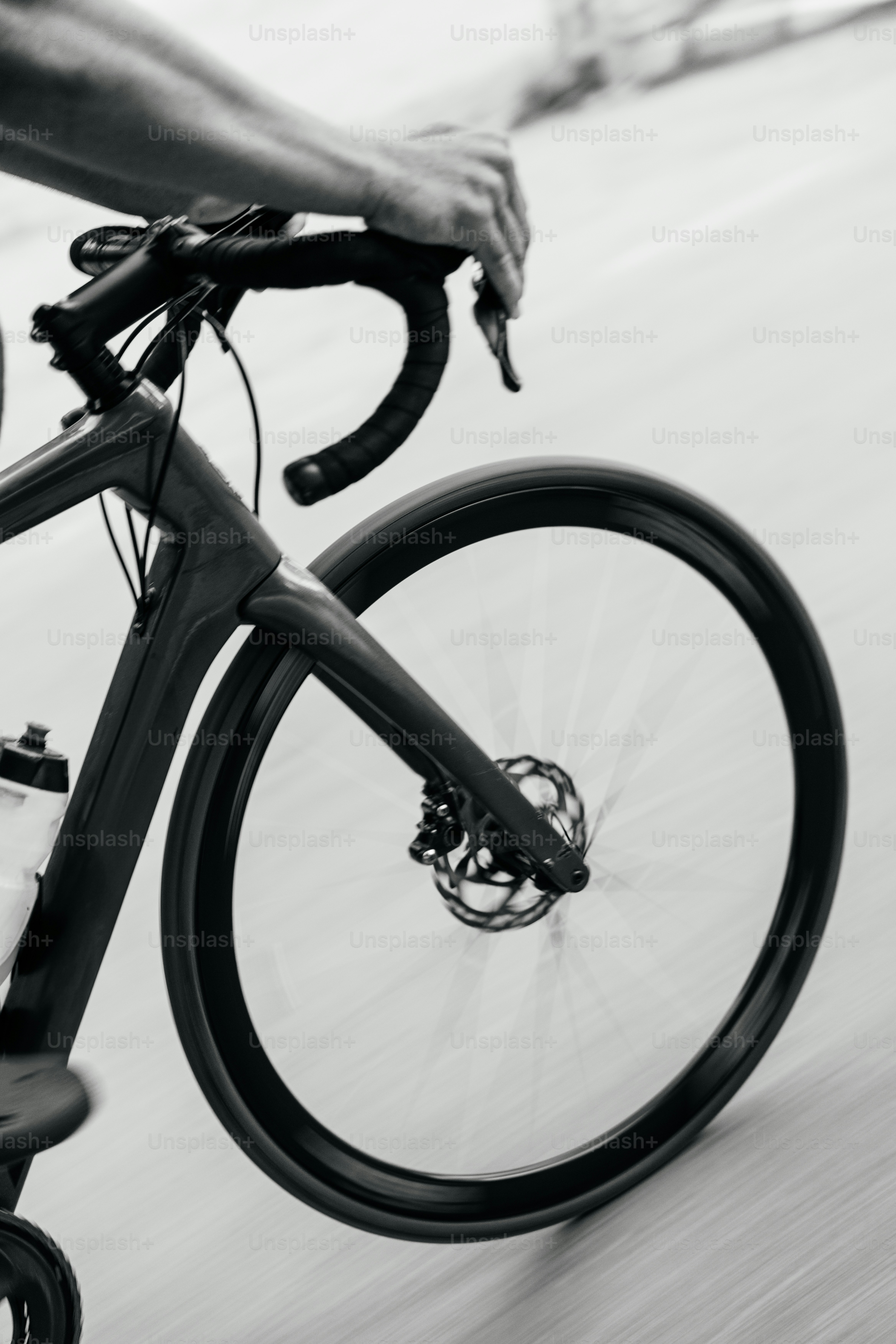 Rider pedals a bicycle on the road.