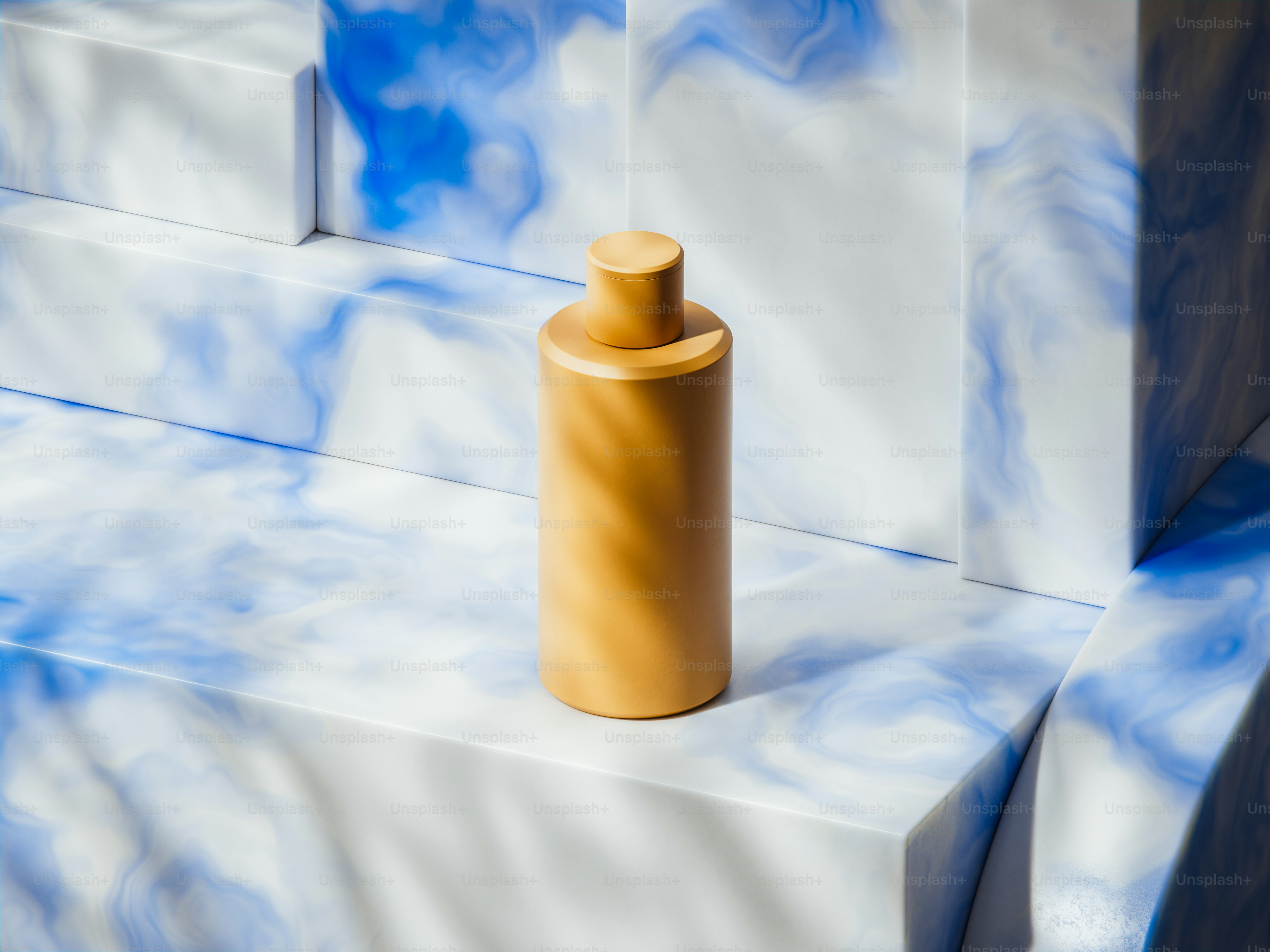 A yellow bottle rests on a blue and white surface.
