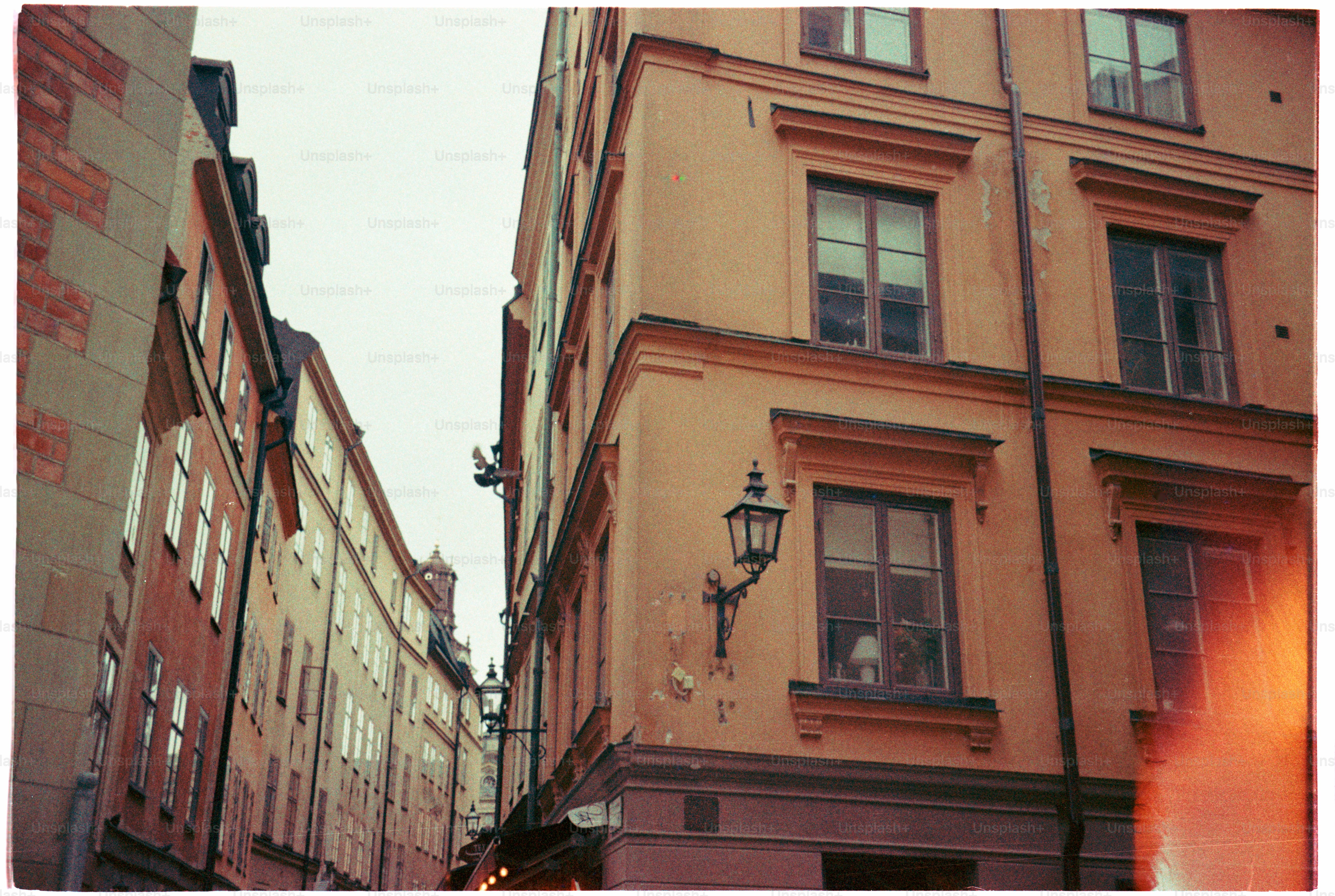 Old buildings line a narrow street.
