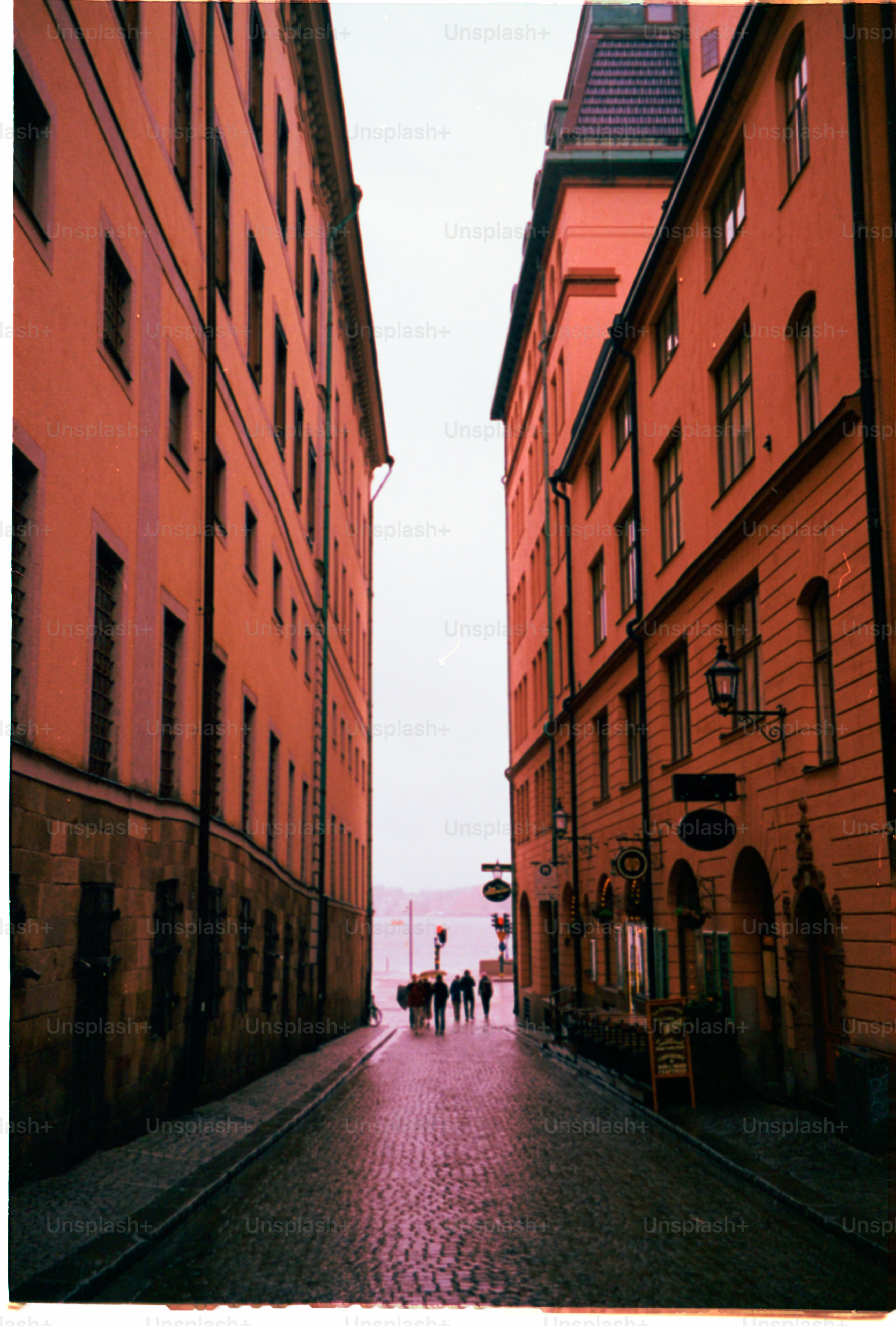 A narrow street leads towards the water.