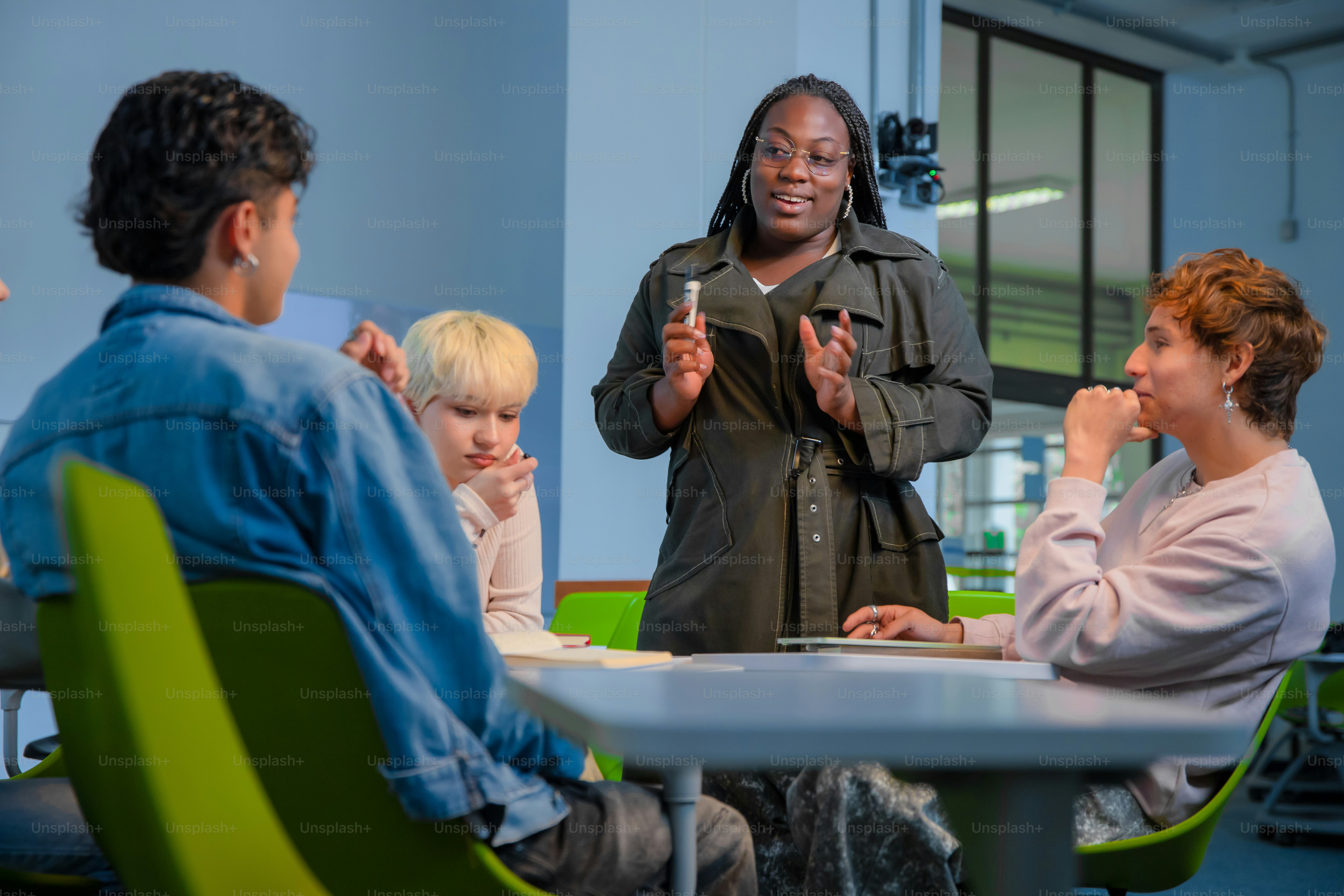 A teacher leads a discussion with students.