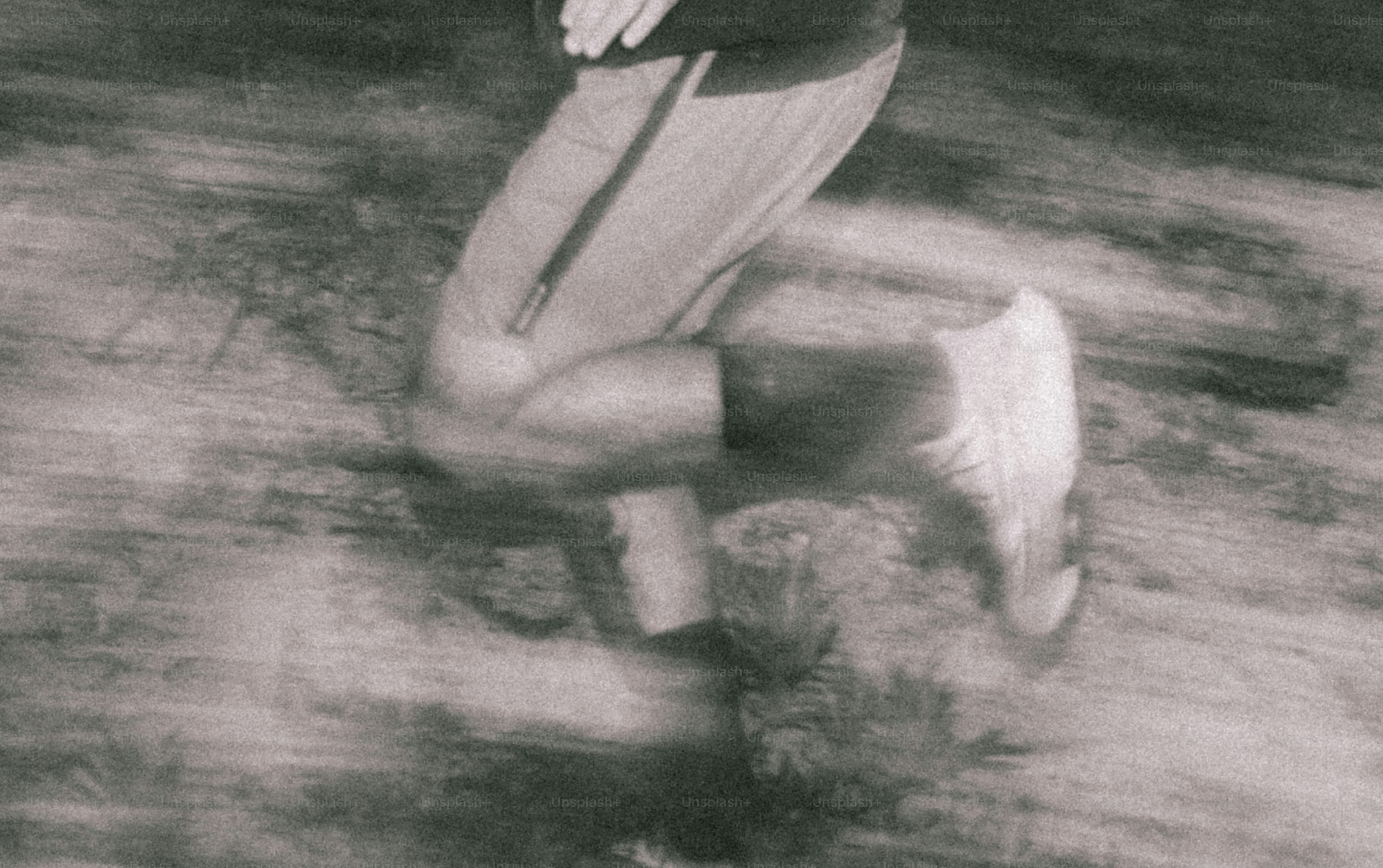 Blurred image of a runner in motion.