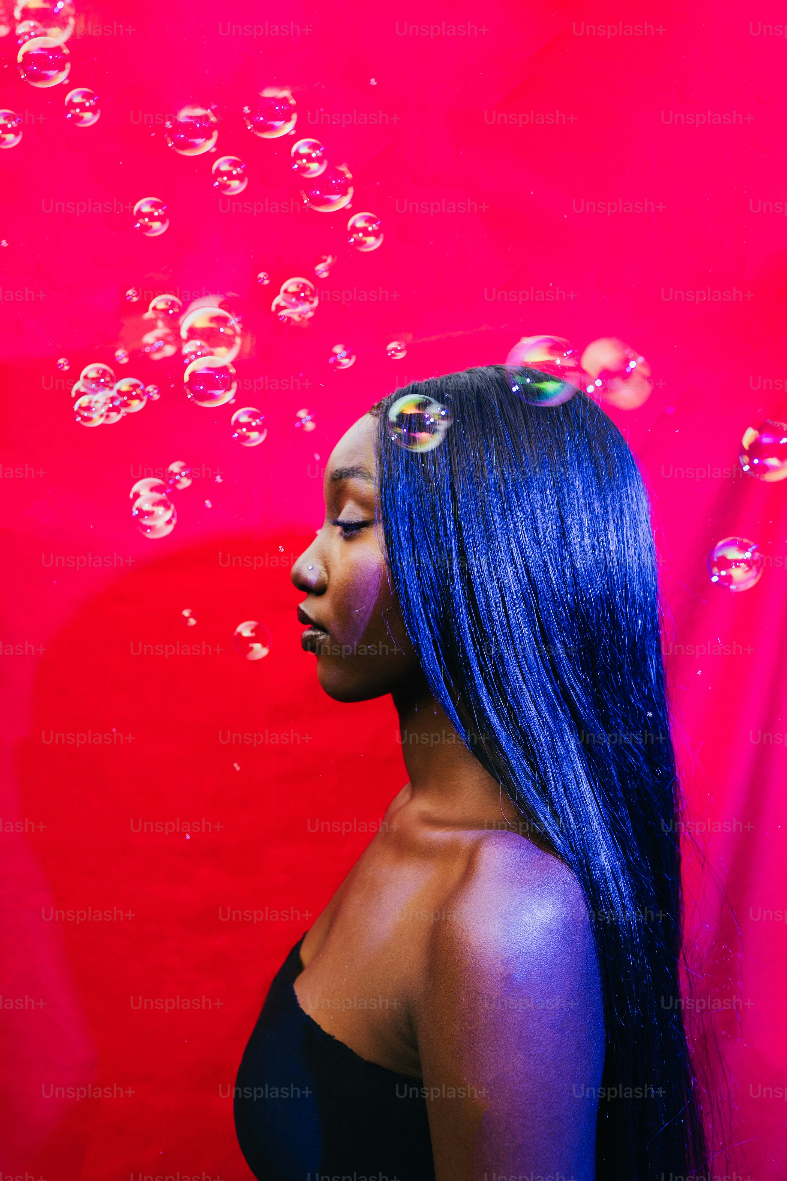 A woman with long hair and bubbles.