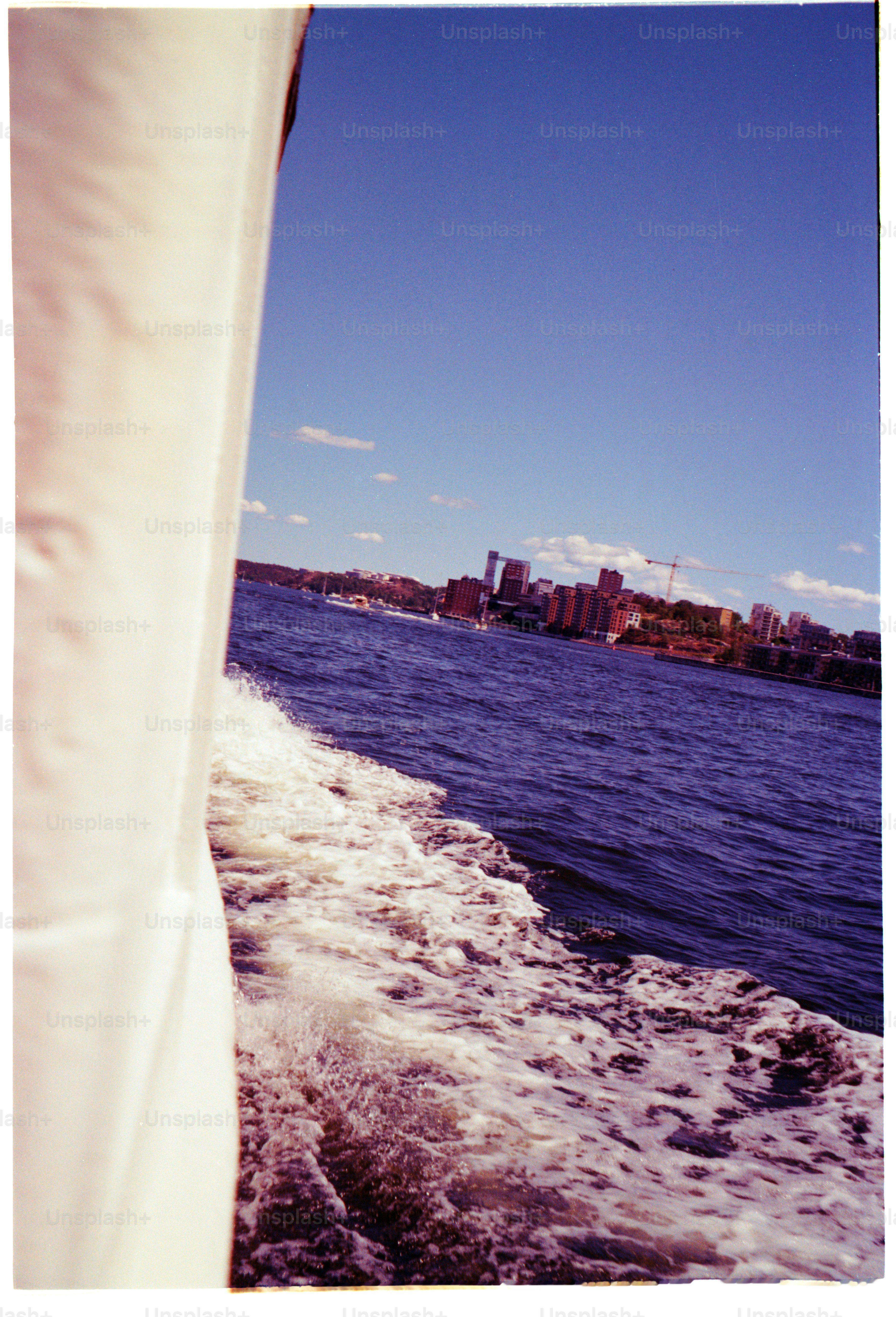 Boat ride with a city skyline in view.