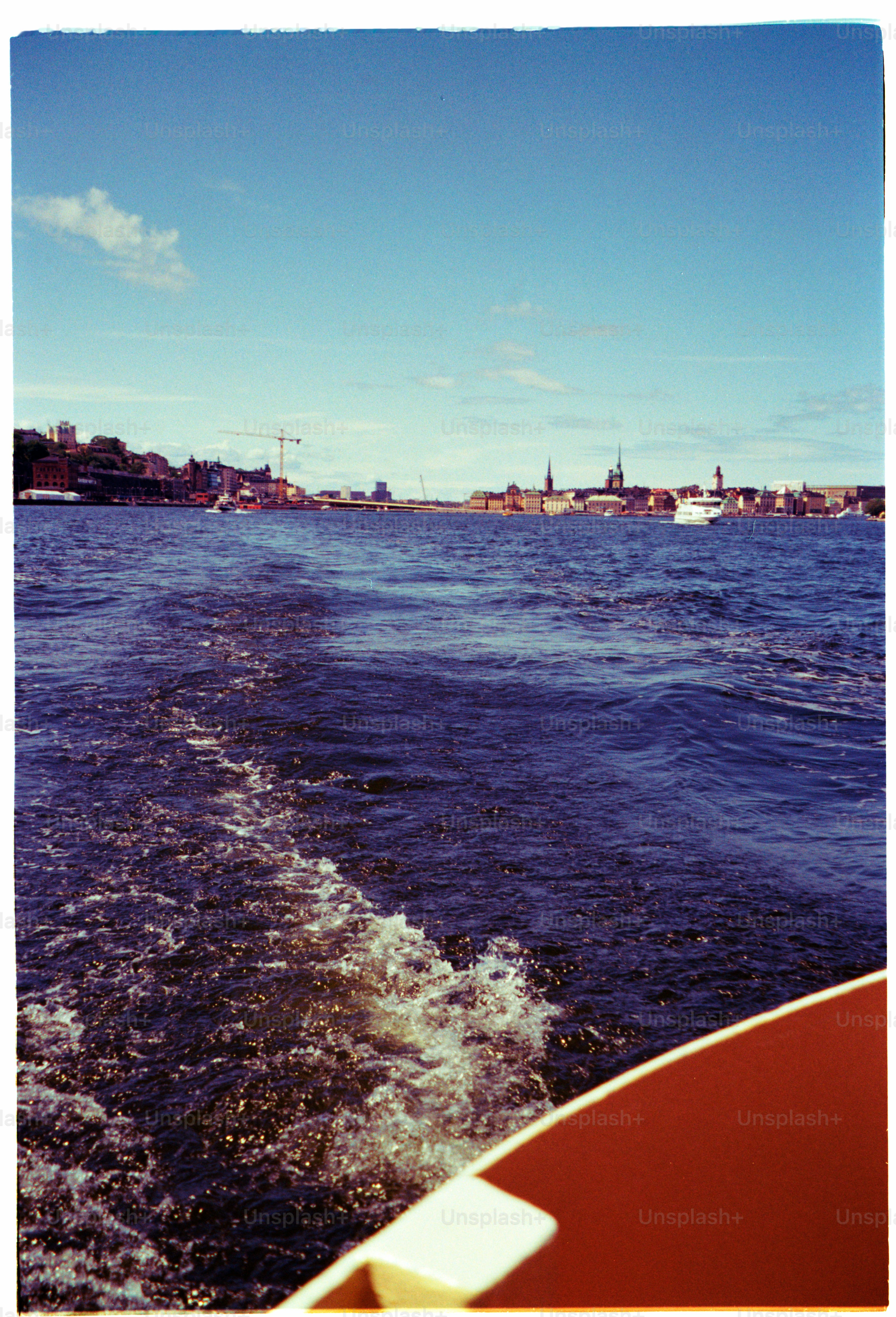 Boat view of a city on the water.