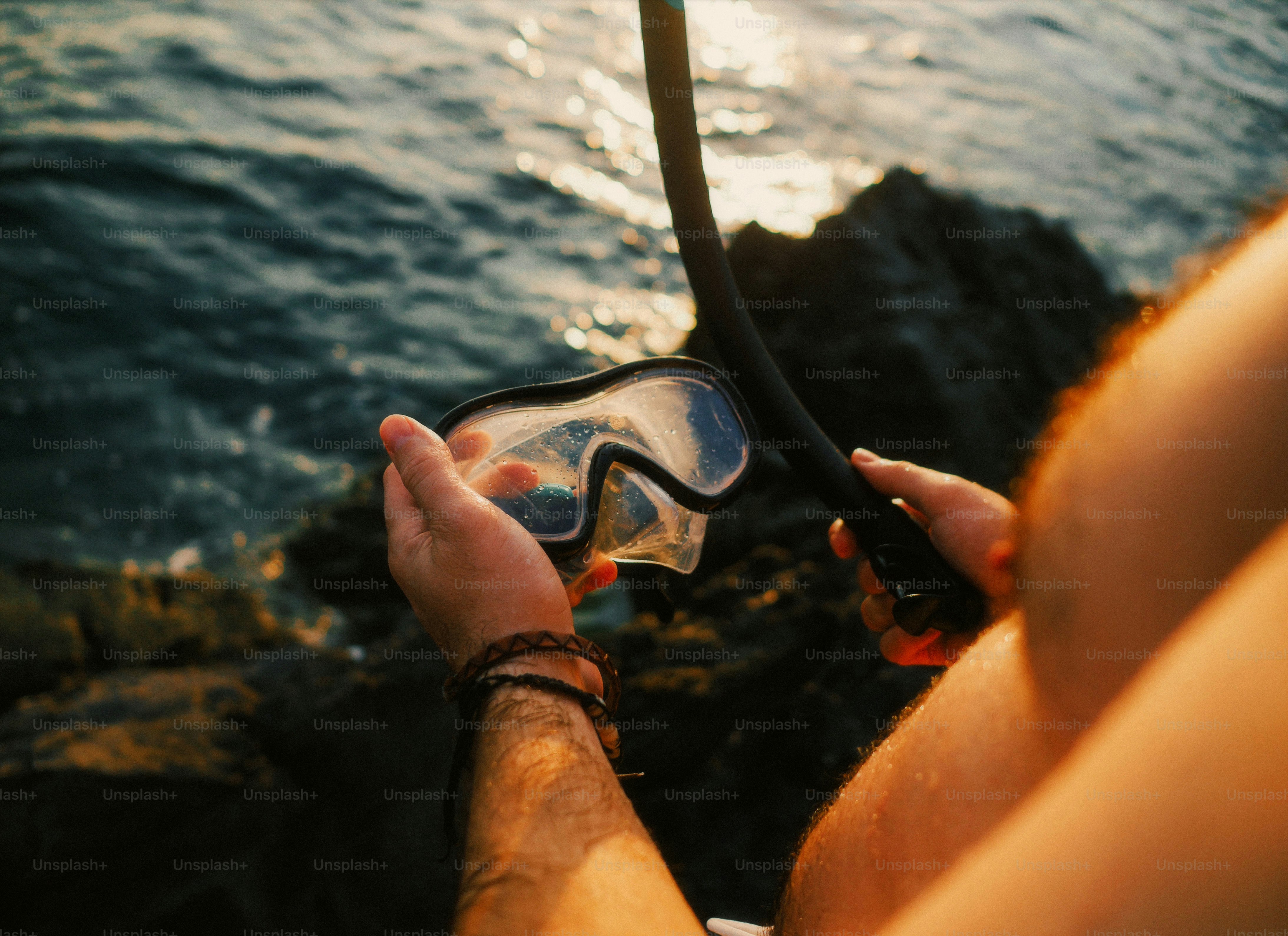 Preparing to snorkel in the ocean.