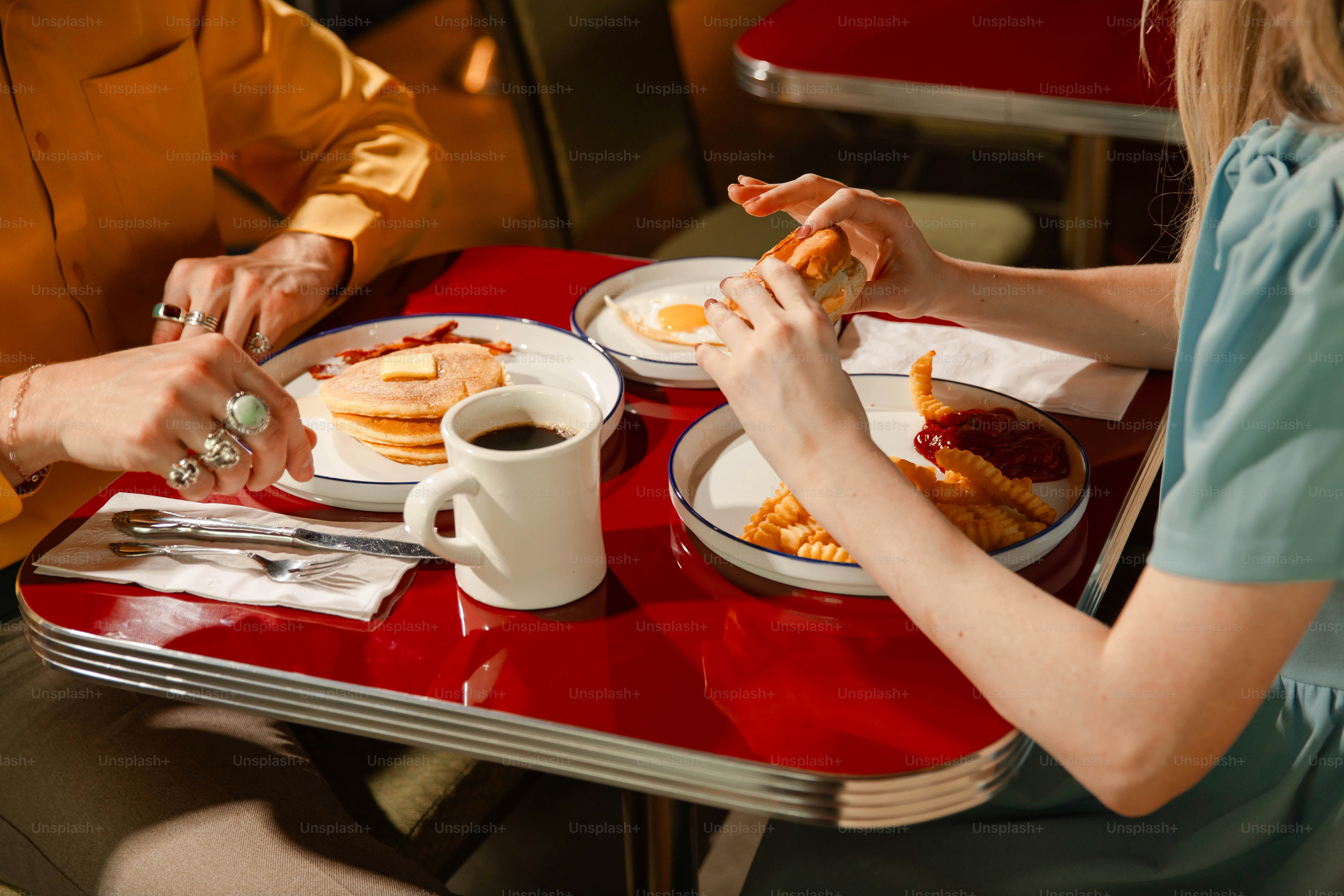 People enjoy a meal together at a diner.