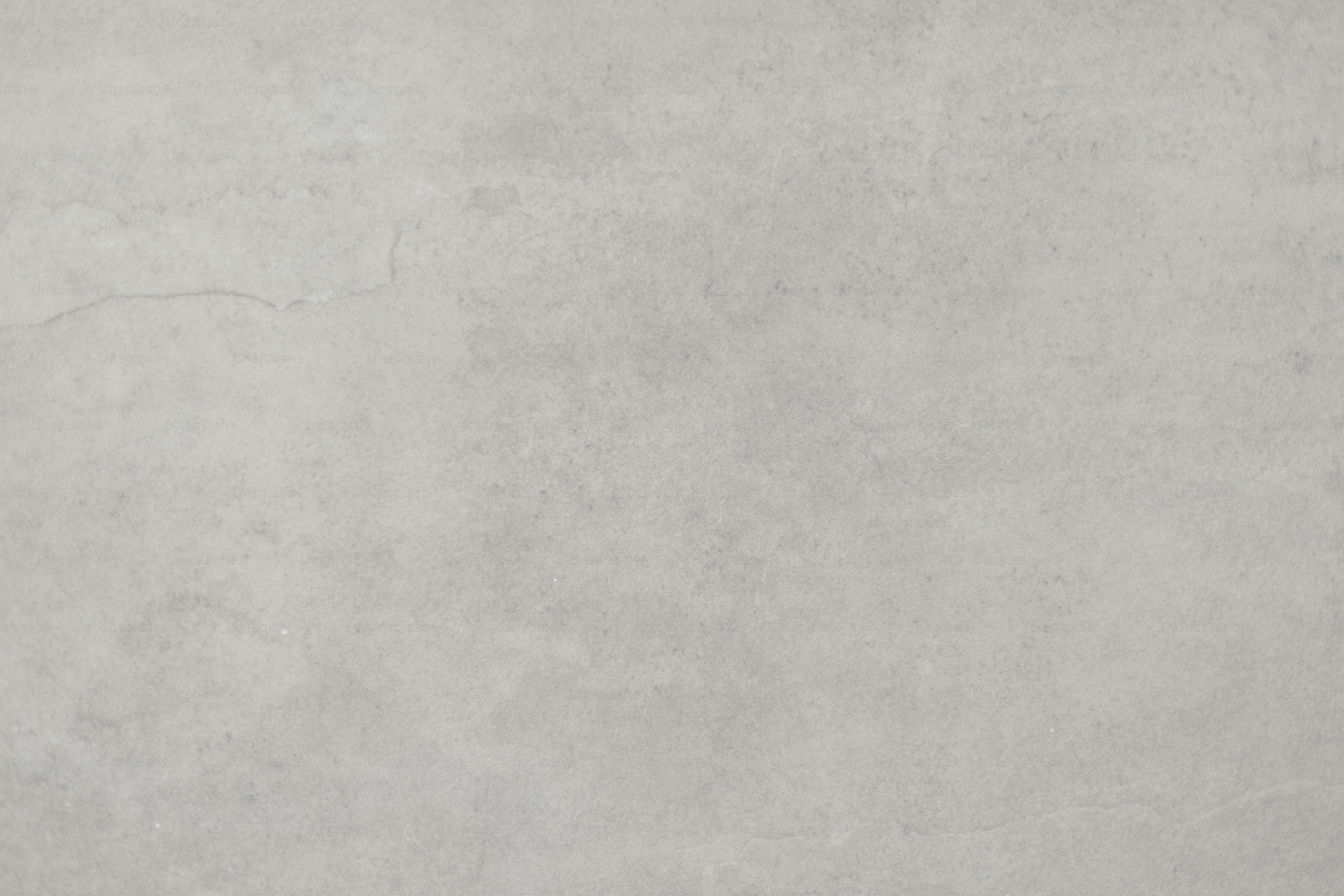 A gray, textured background fills the frame.